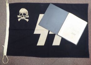A German World War II era SS flag; and an album of miscellaneous German military orders/documents (