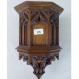 A late 19thC Gothic pulpit design, oak wall bracket with a drop finial  14"h
