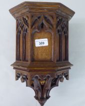 A late 19thC Gothic pulpit design, oak wall bracket with a drop finial  14"h