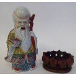 An early 20thC Chinese porcelain figure, a robed, standing scholar, decorated in famille rose and