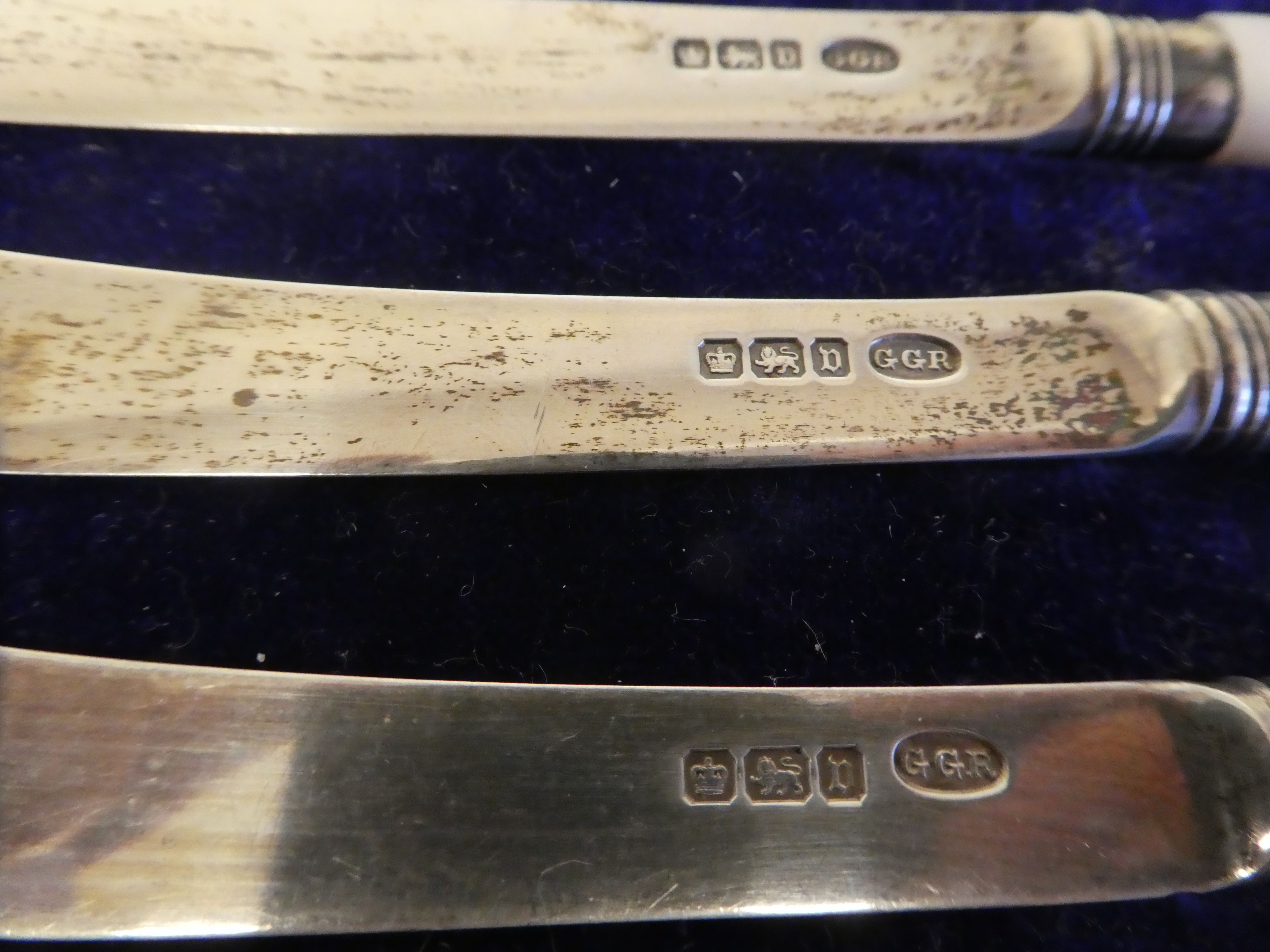 A set of six silver dessert knives, on mother-of-pearl handles  cased; and a matched set of - Image 3 of 7