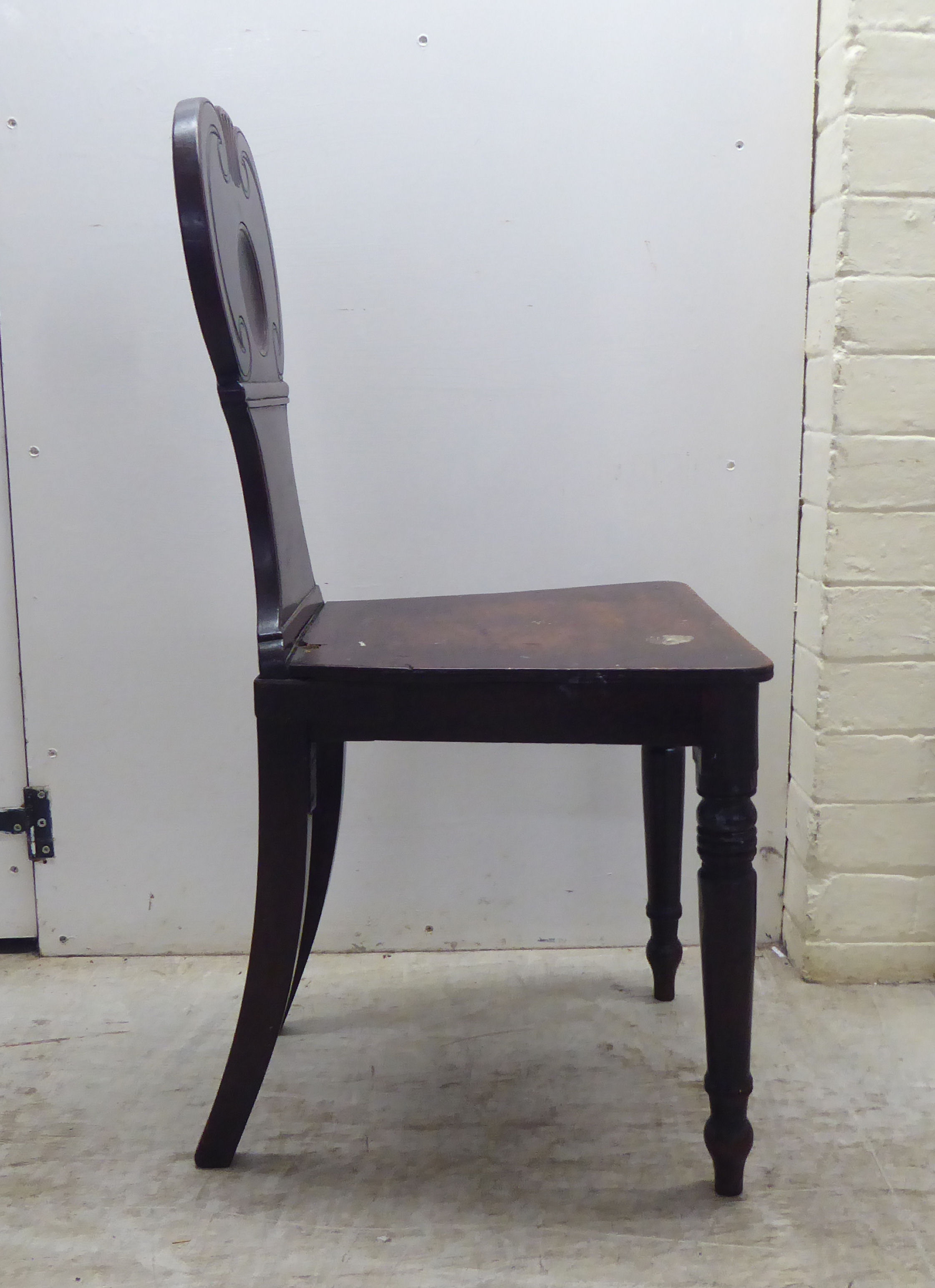 A William IV mahogany hall chair with a twin C-scroll design back, the solid seat raised on ring - Image 2 of 5