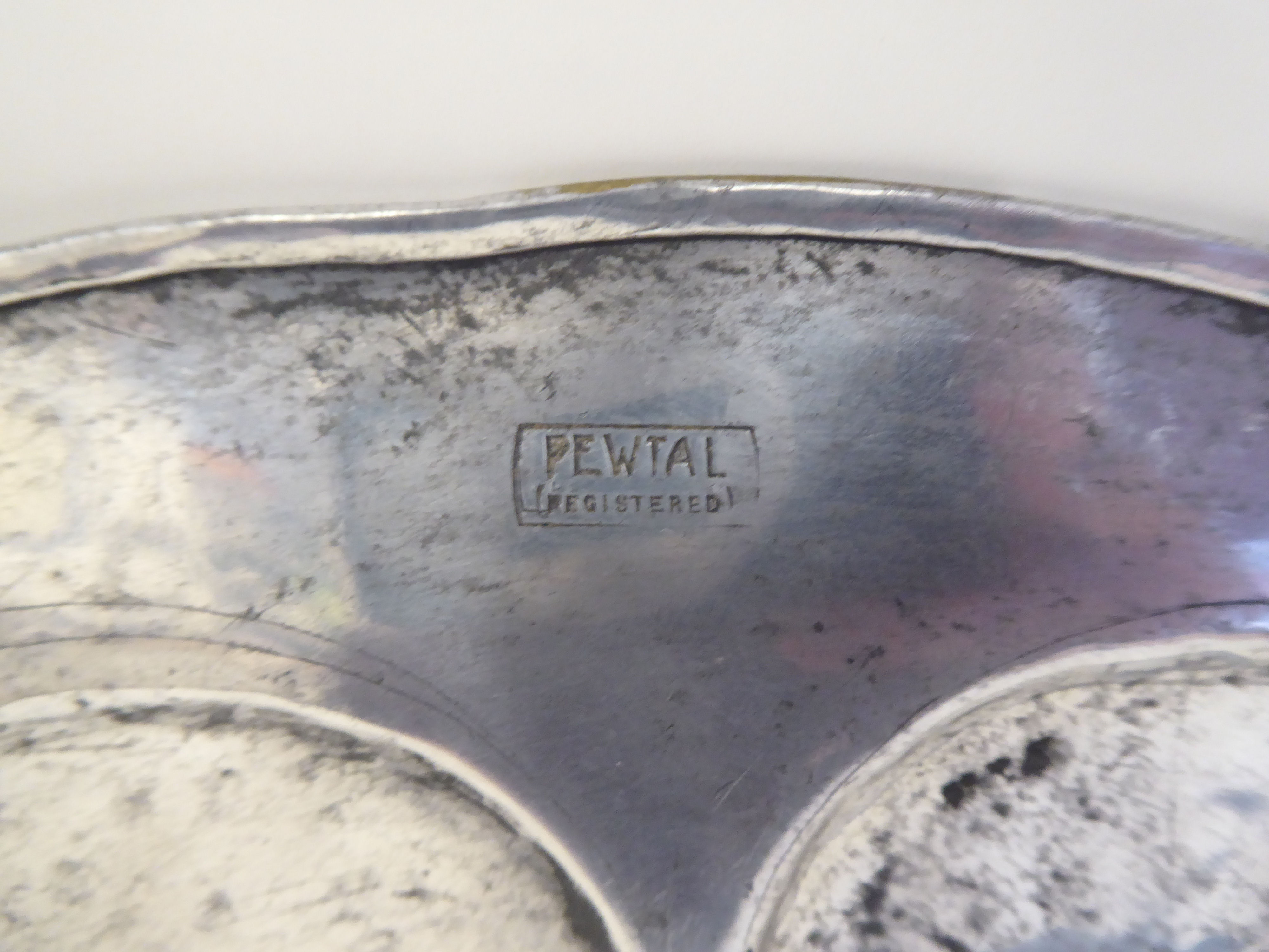 A Pewtal dish with a depressed centre, the wide rim ornamented in Art Nouveau inspired designs  15" - Image 3 of 3