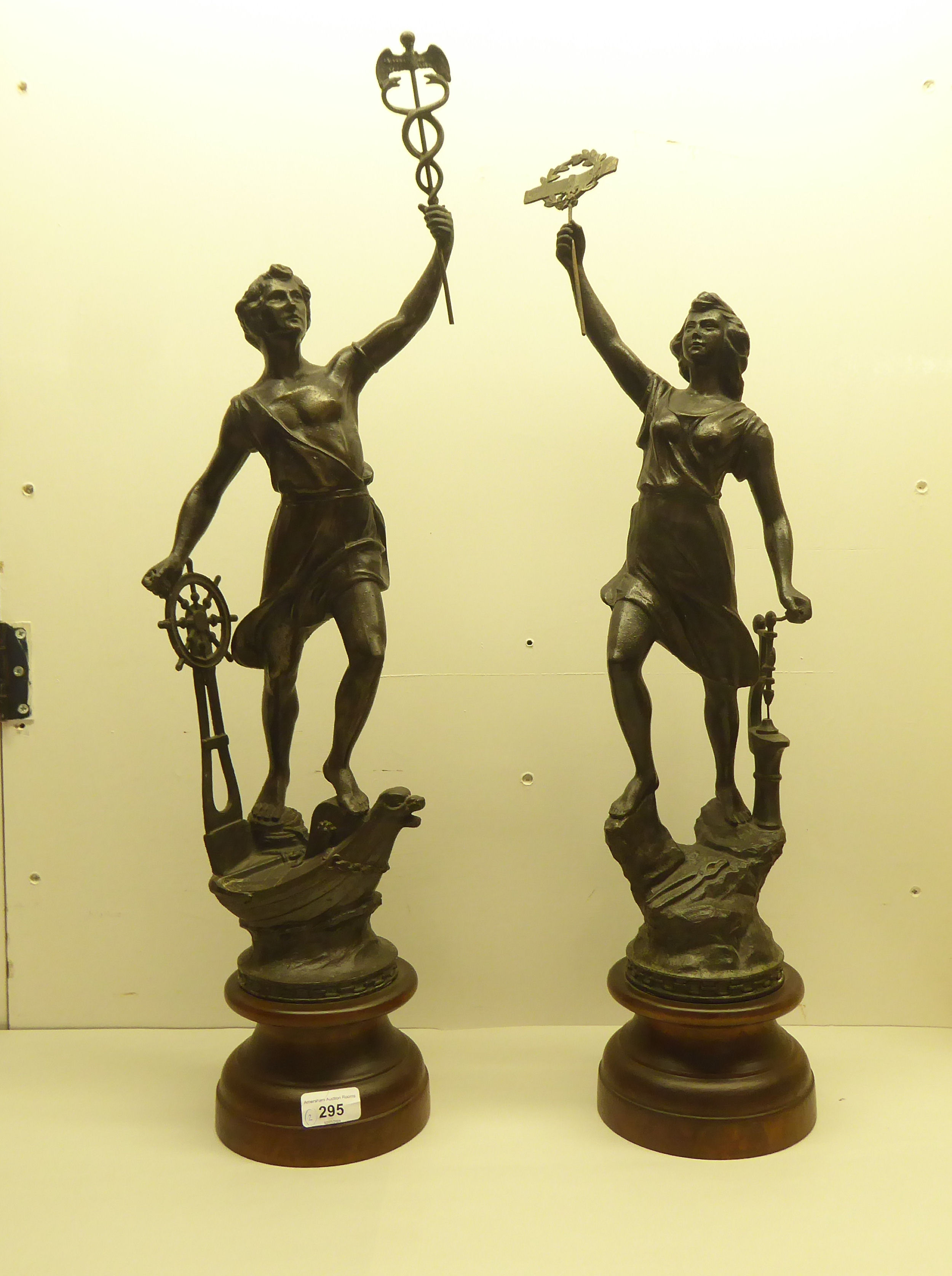 Two 20thC spelter figures, on a plinth  29"h overall