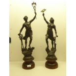 Two 20thC spelter figures, on a plinth  29"h overall
