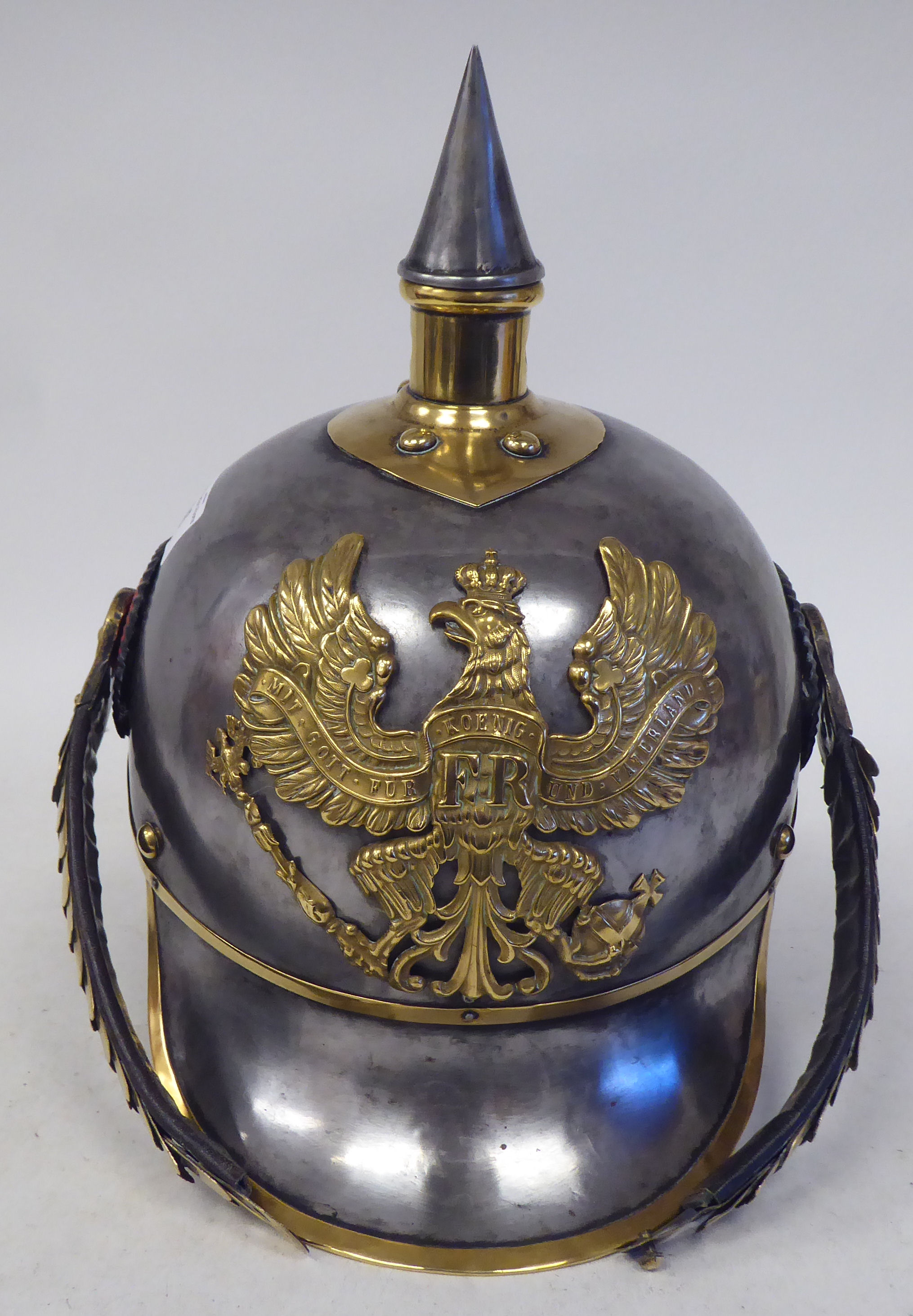 A German Great War spiked, polished steel and brass cavalry helmet with a hide liner and - Image 2 of 6