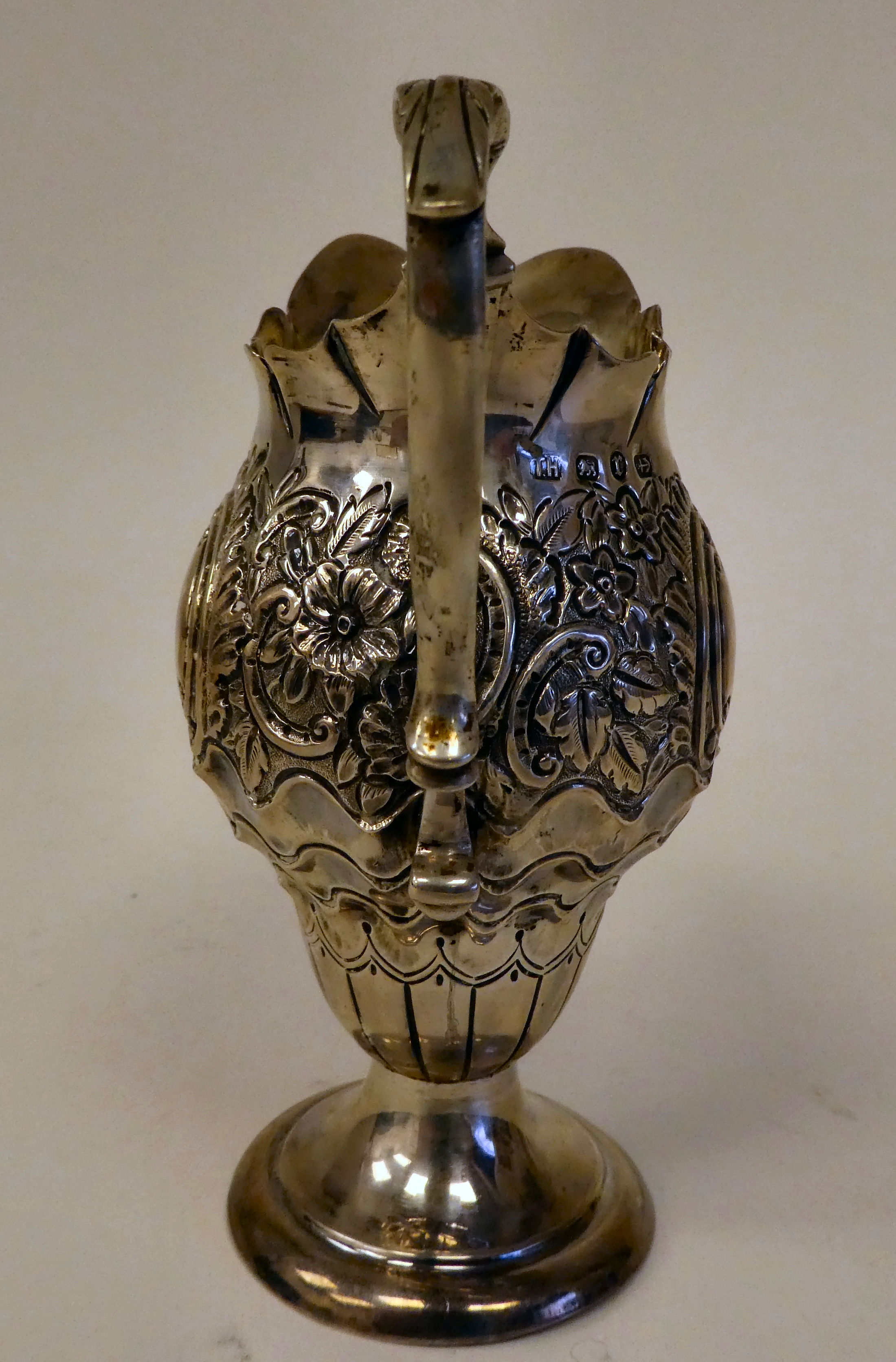 A late Victorian silver pedestal cream jug of pear form with a double C-scrolled handle, scaled, - Image 2 of 5