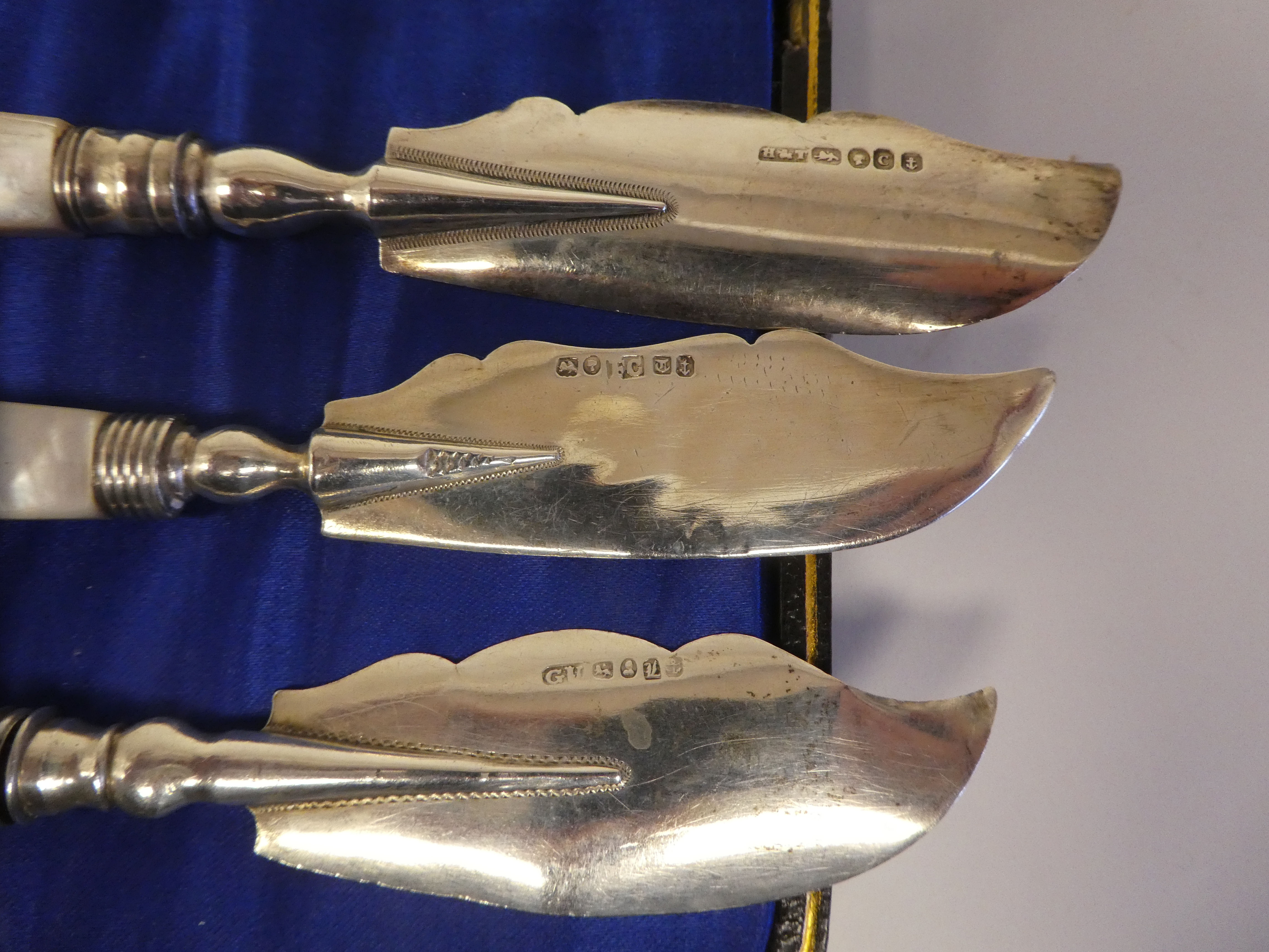 A set of six silver dessert knives, on mother-of-pearl handles  cased; and a matched set of - Image 5 of 7