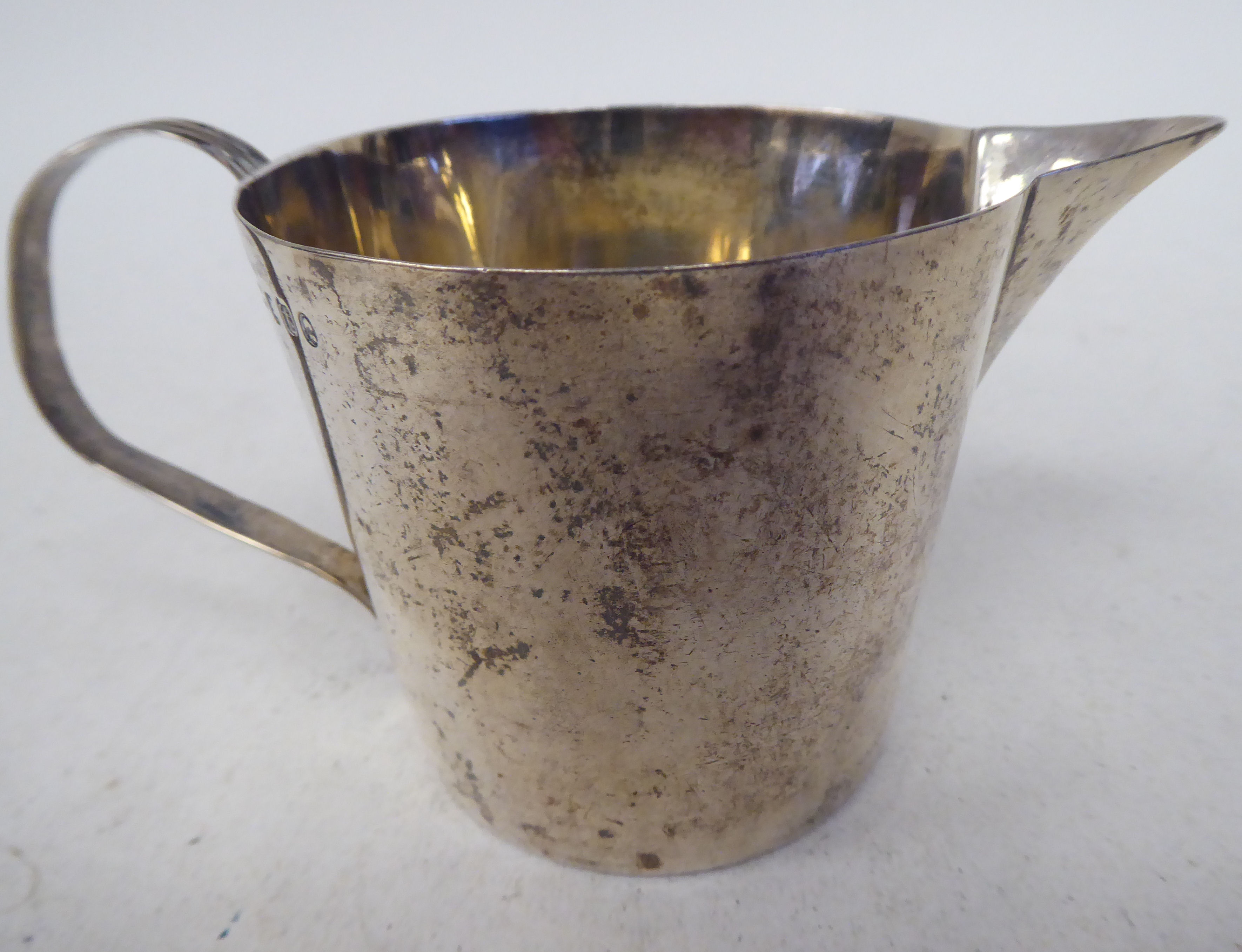 A George III silver jug of round, tapered form with a loop handle  TO  London 1894  (approx. - Image 2 of 4