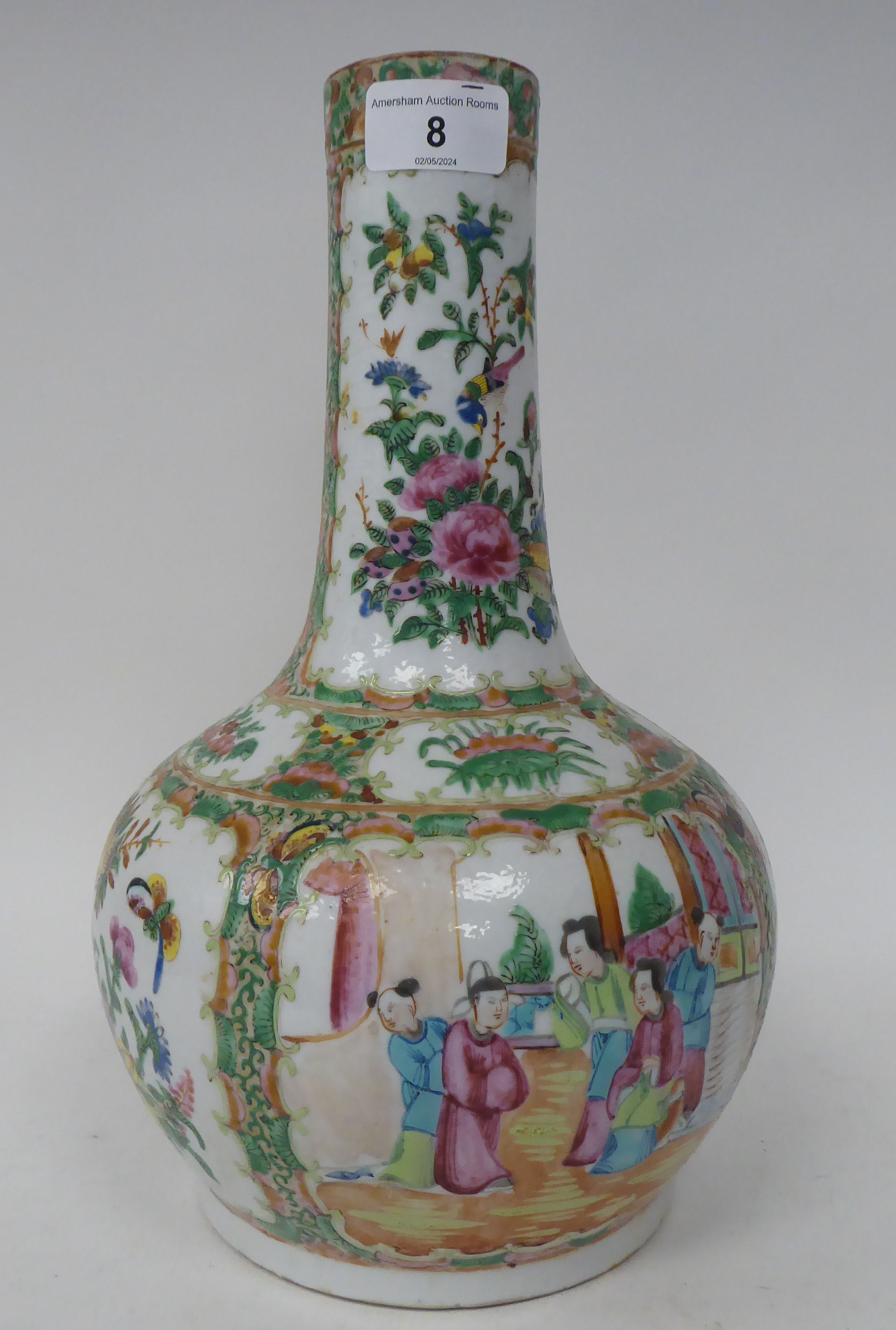 A late 19thC Chinese Canton porcelain bulbous bottle vase with a long, narrow and tapered neck,