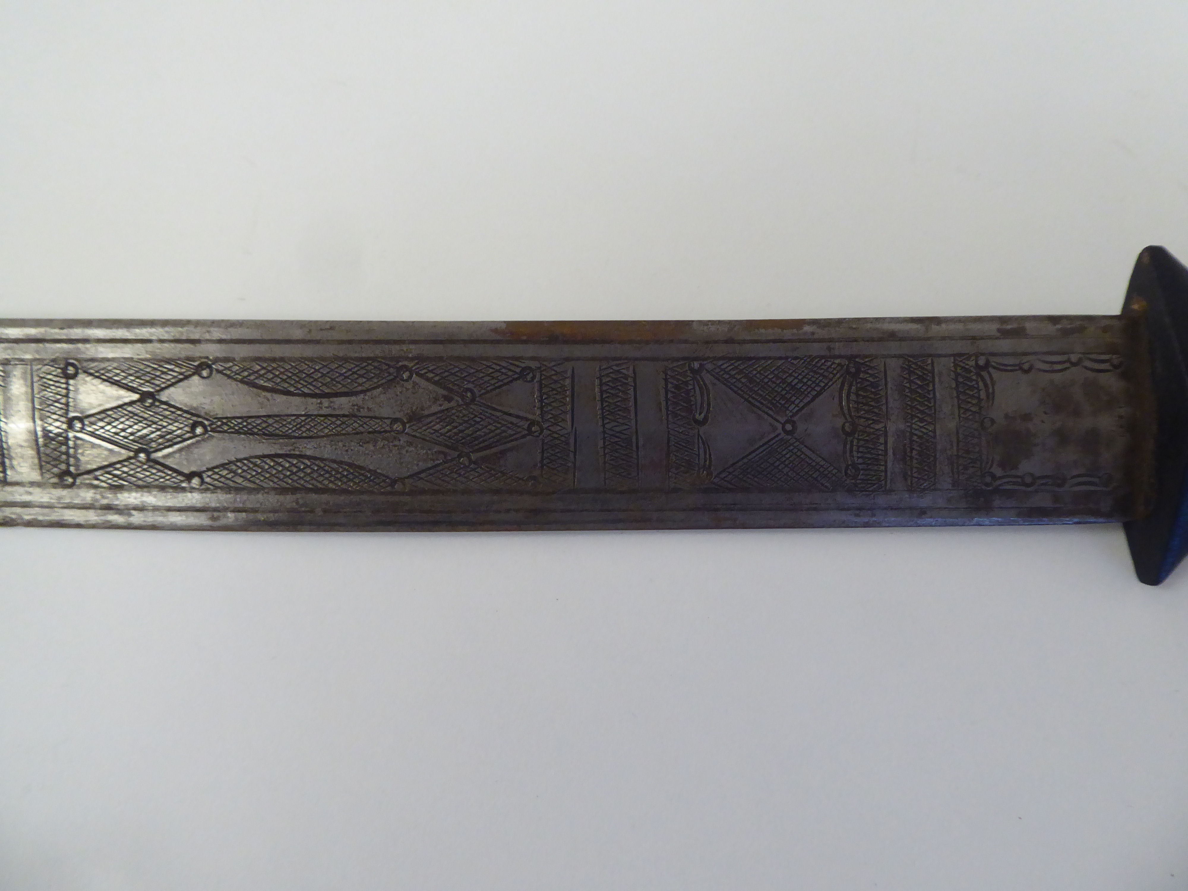 A North African dagger with a carved and black painted handgrip, the blade with engraved ornament - Image 3 of 7