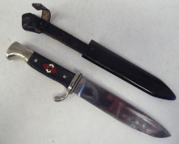 A German Third Reich era Hitler Youth knife with a rivetted two-part handgrip and emblem, the