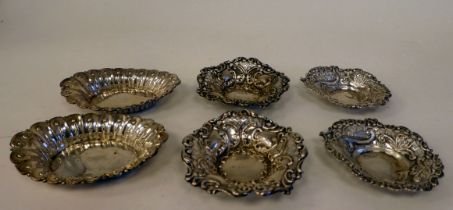 Three pairs of various small, impressed and pierced sweet dishes of circular, oval and heart design