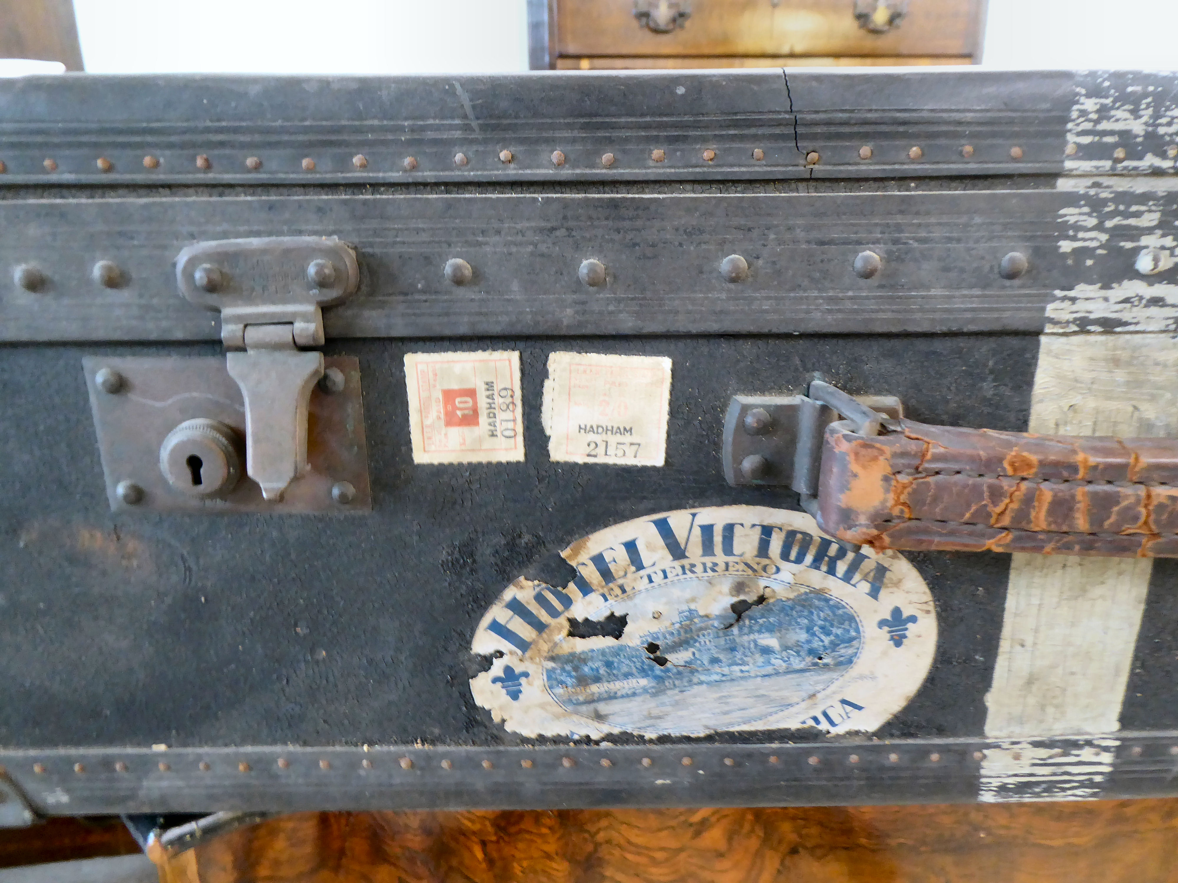 An early 20thC moulded/press composition travelling trunk with a hinged lid, bearing various - Image 2 of 9