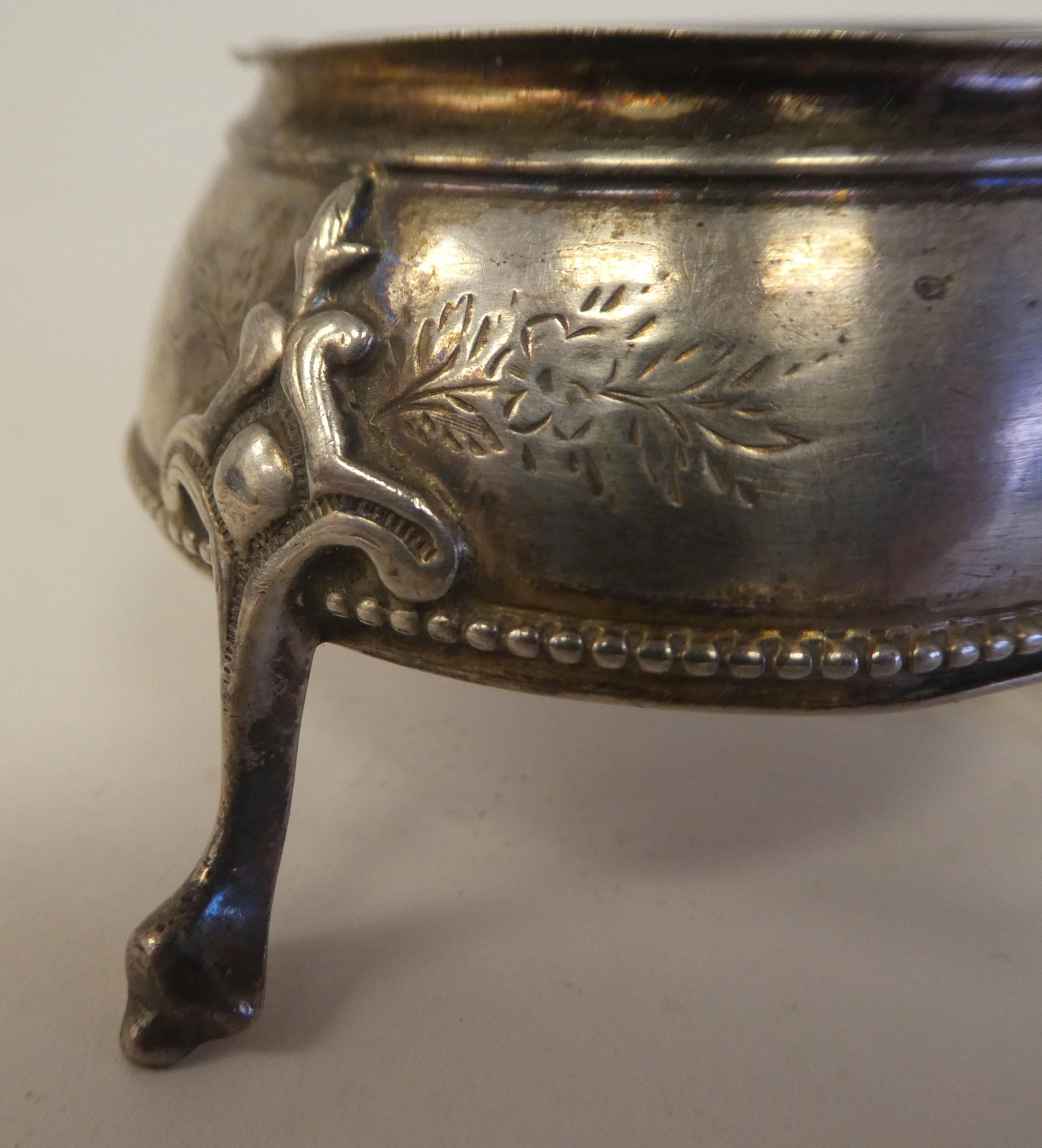 A pair of George III silver shallow, bulbous salt cellars with blue glass liners, on hoof feet - Image 6 of 8