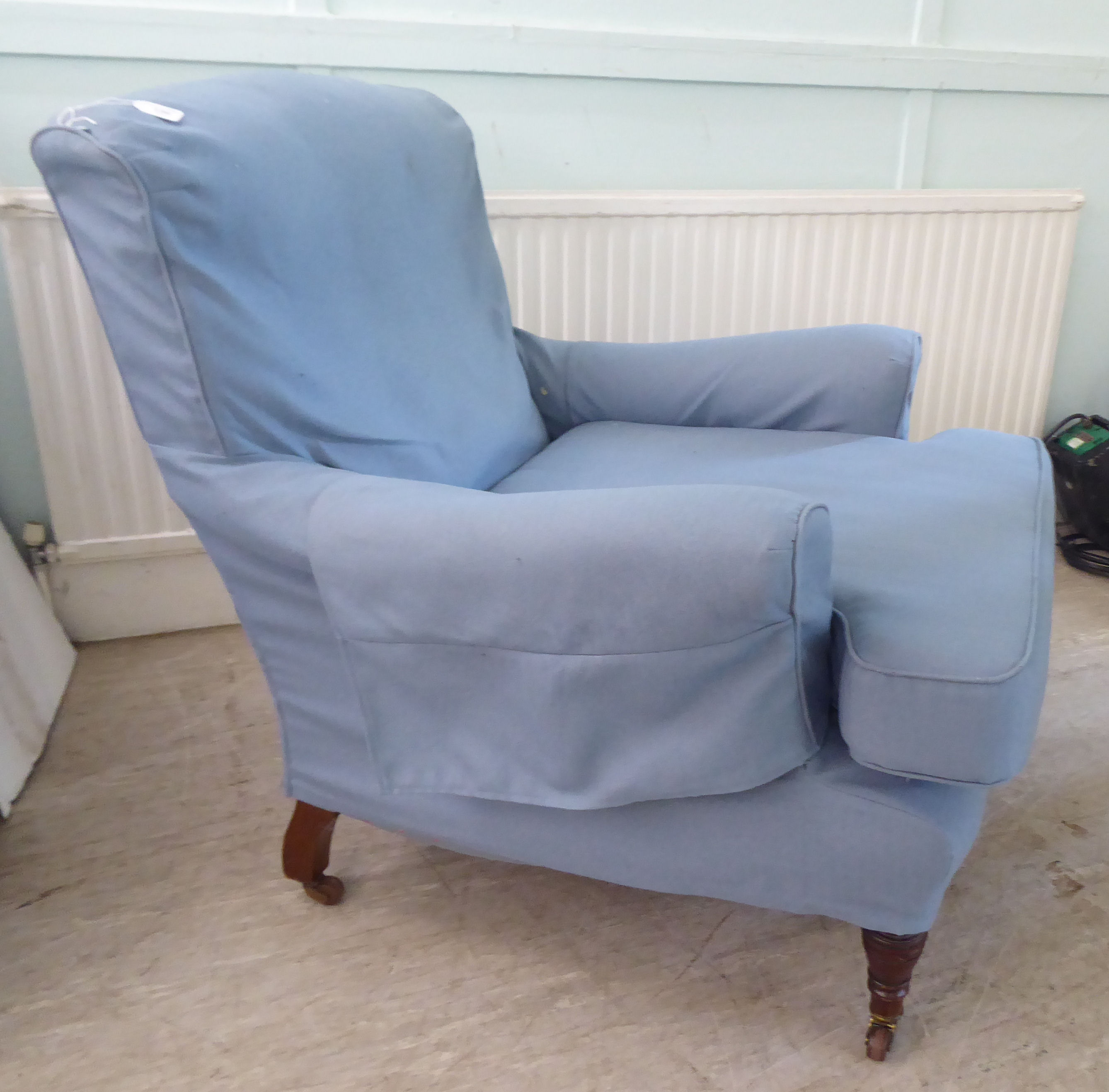 A late Victorian library chair with a level back and enclosed arms, re-upholstered in patterned blue - Image 3 of 4