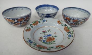 19thC Chinese porcelain: to include a pair of footed bowls, decorated in colours with floral designs