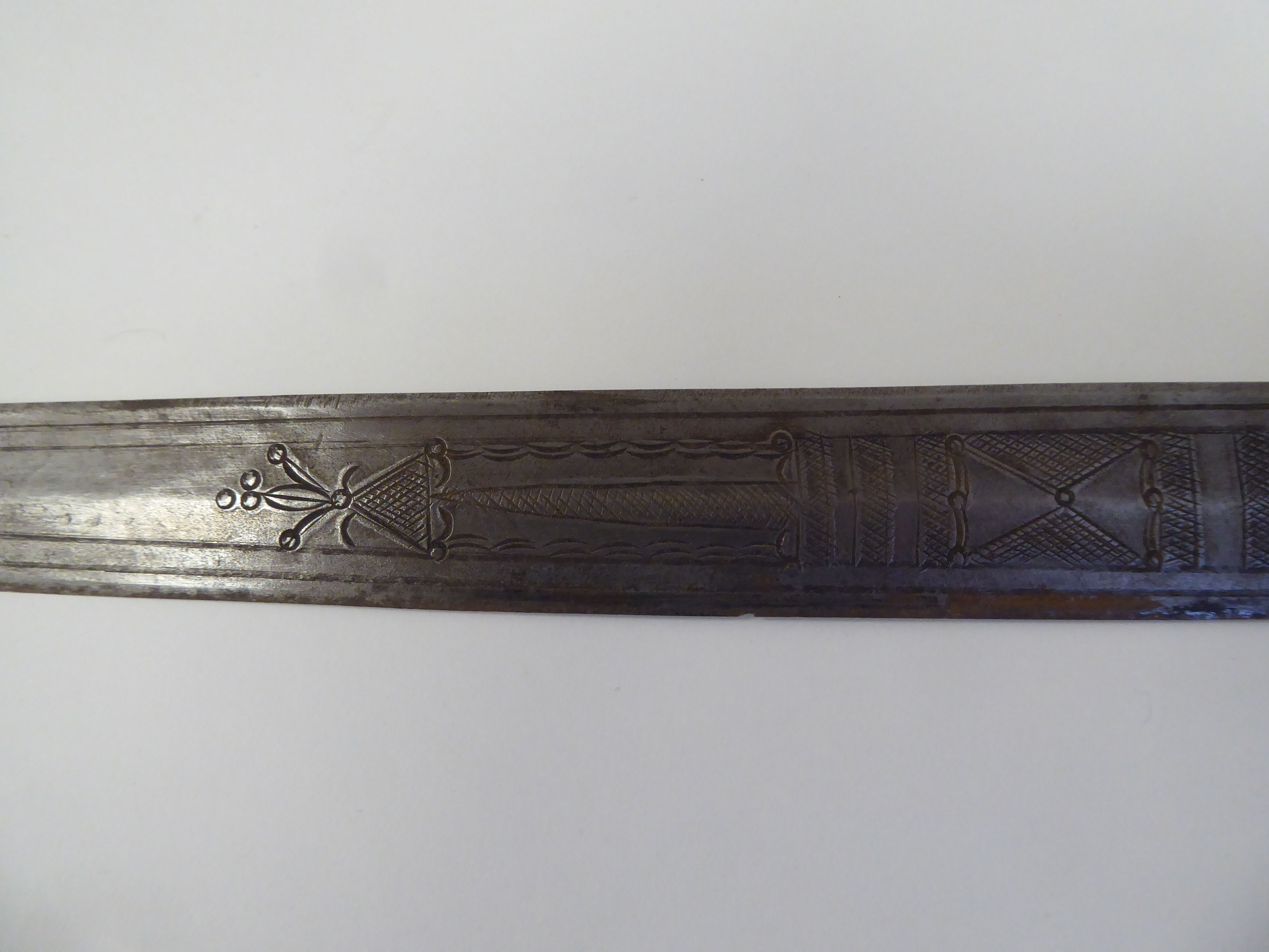 A North African dagger with a carved and black painted handgrip, the blade with engraved ornament - Image 4 of 7