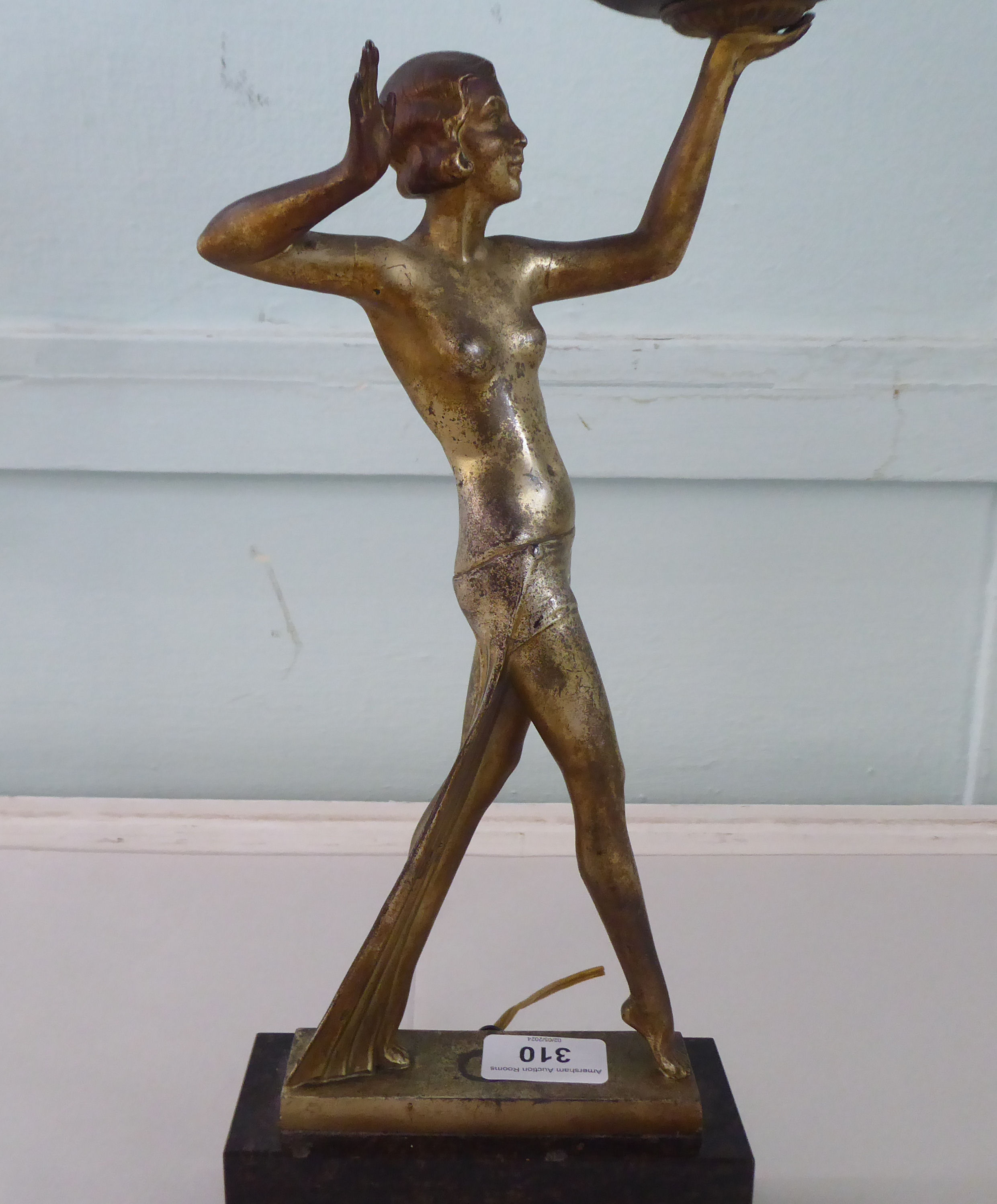 A 1930s Art Deco patinated and gilded table lamp. fashioned as a woman holding a white glass - Image 3 of 5