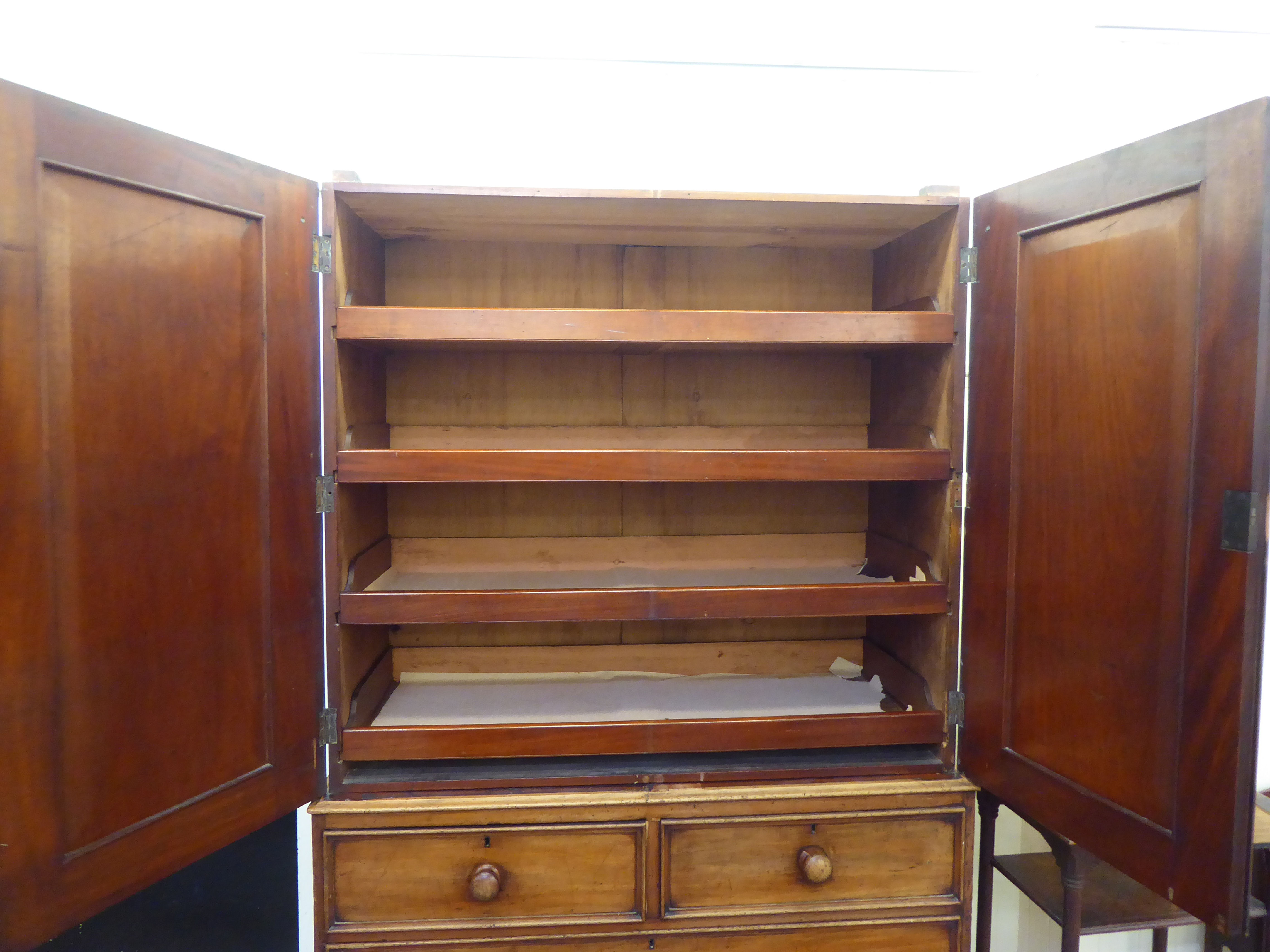 A mid Victorian mahogany linen press (cornice missing) with a pair of doors, enclosing four drawers, - Image 2 of 5