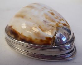 An 18th/19thC cowrie shell and silver mounted snuff box with a flush fitting hinged lid and
