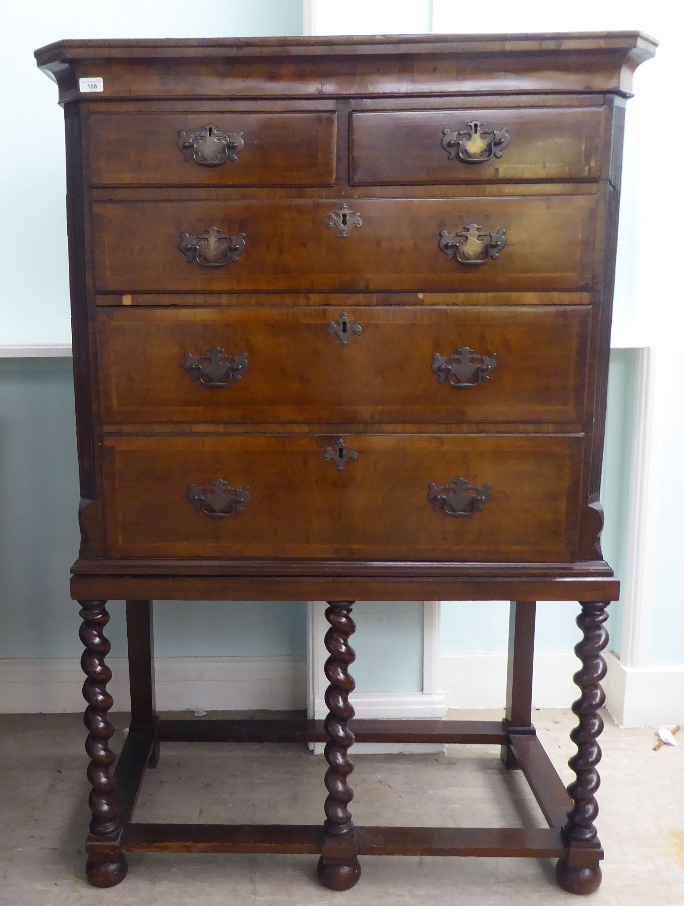 A 19thC and later mahogany chest on stand, comprising two short/three long drawers, between canted