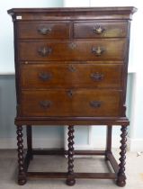 A 19thC and later mahogany chest on stand, comprising two short/three long drawers, between canted