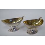 A pair of George IV silver and parcel gilt, oval salt cellars with applied wire rims; and a pair