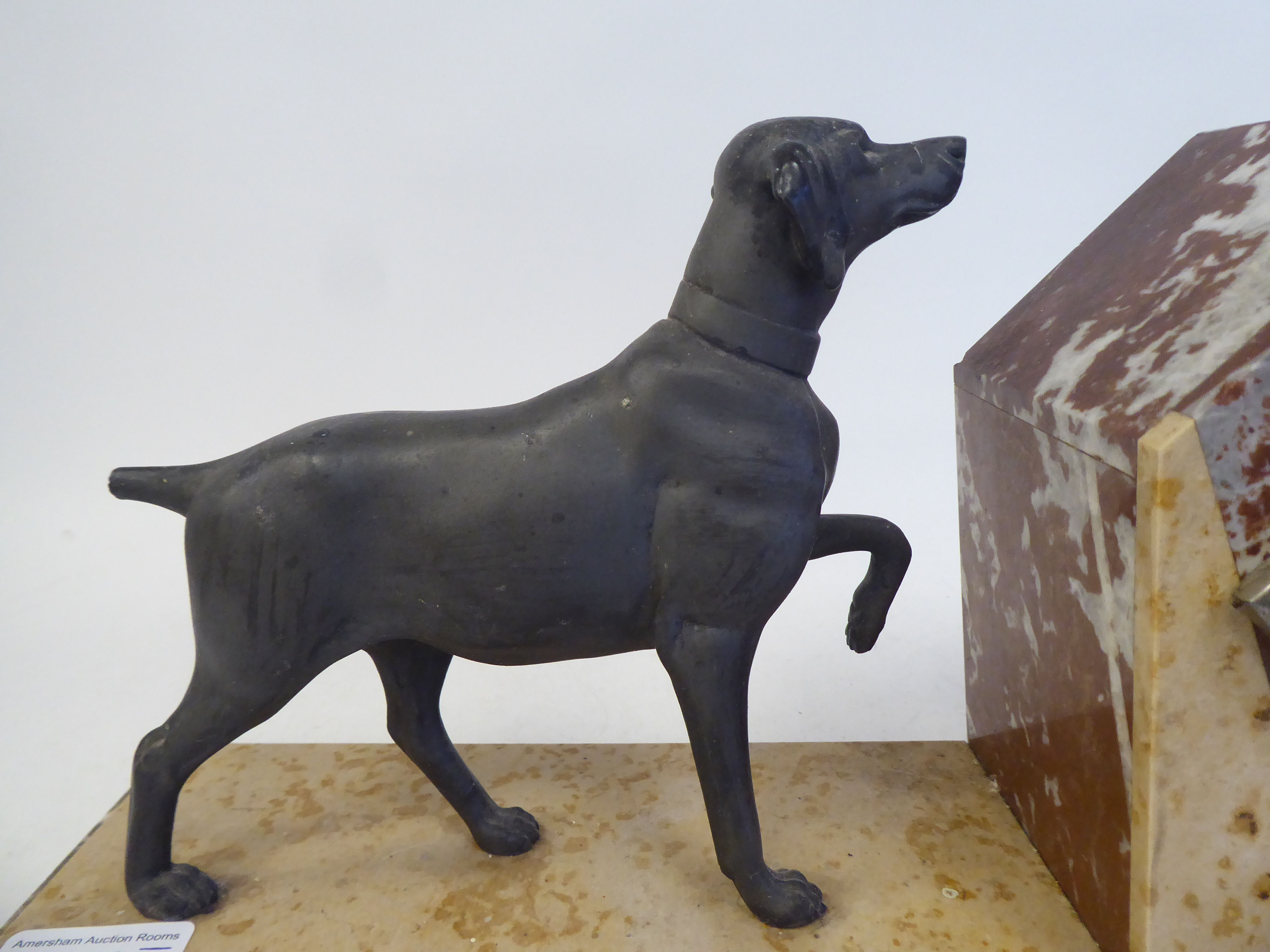 An Art Deco multi-coloured marble cased mantel clock, surmounted by a spelter standing hound; the - Image 2 of 8