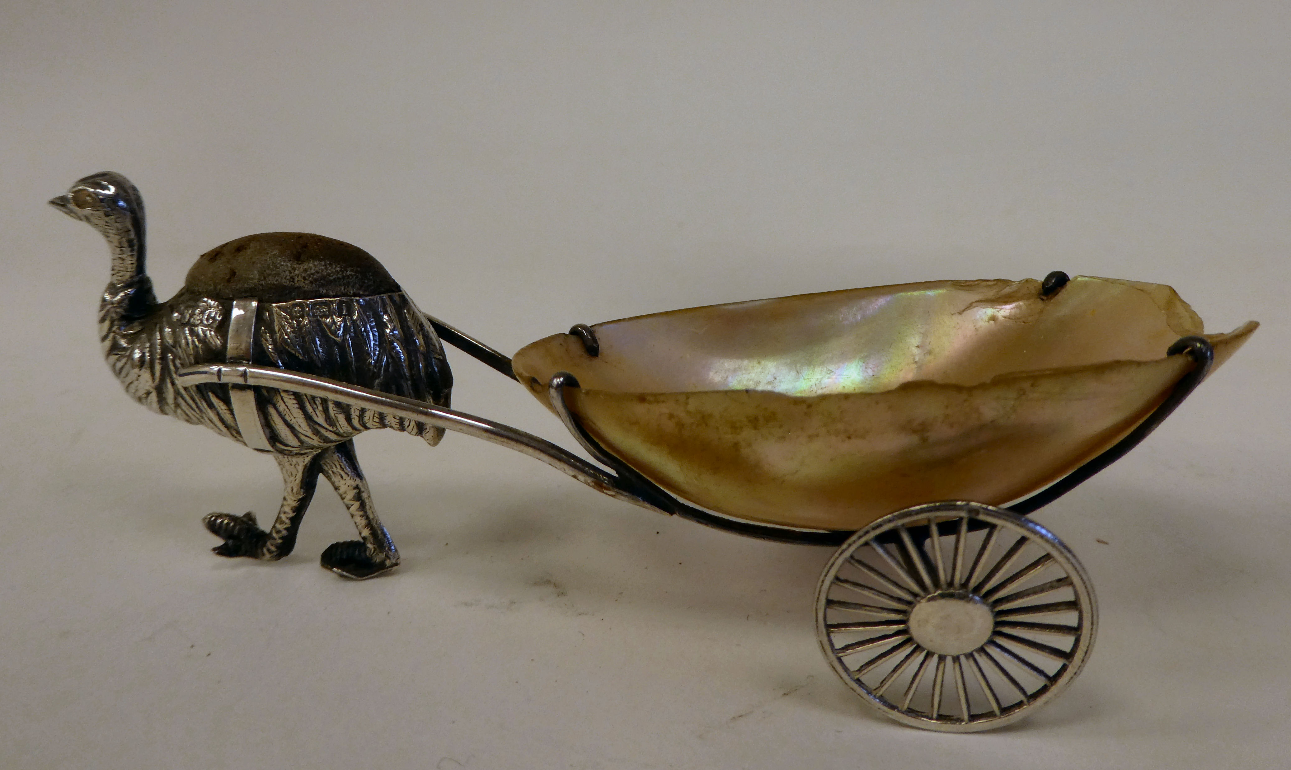 An Edwardian novelty silver pin cushion, fashioned as an ostrich pulling a two wheeled seashell  S & - Image 2 of 4