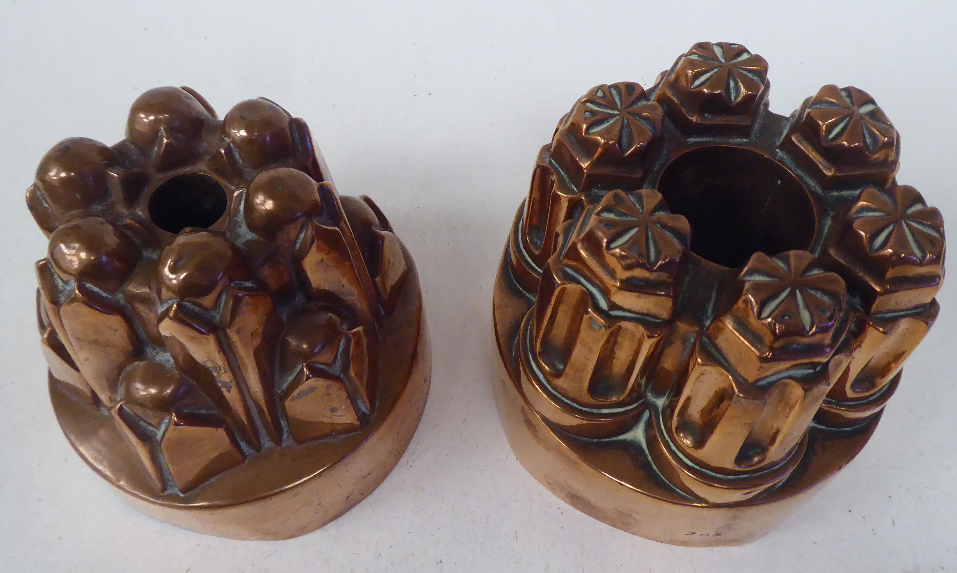 A 19thC copper, circular jelly mould of circular turret design  5"dia; and another, similar  5.25" - Image 2 of 3