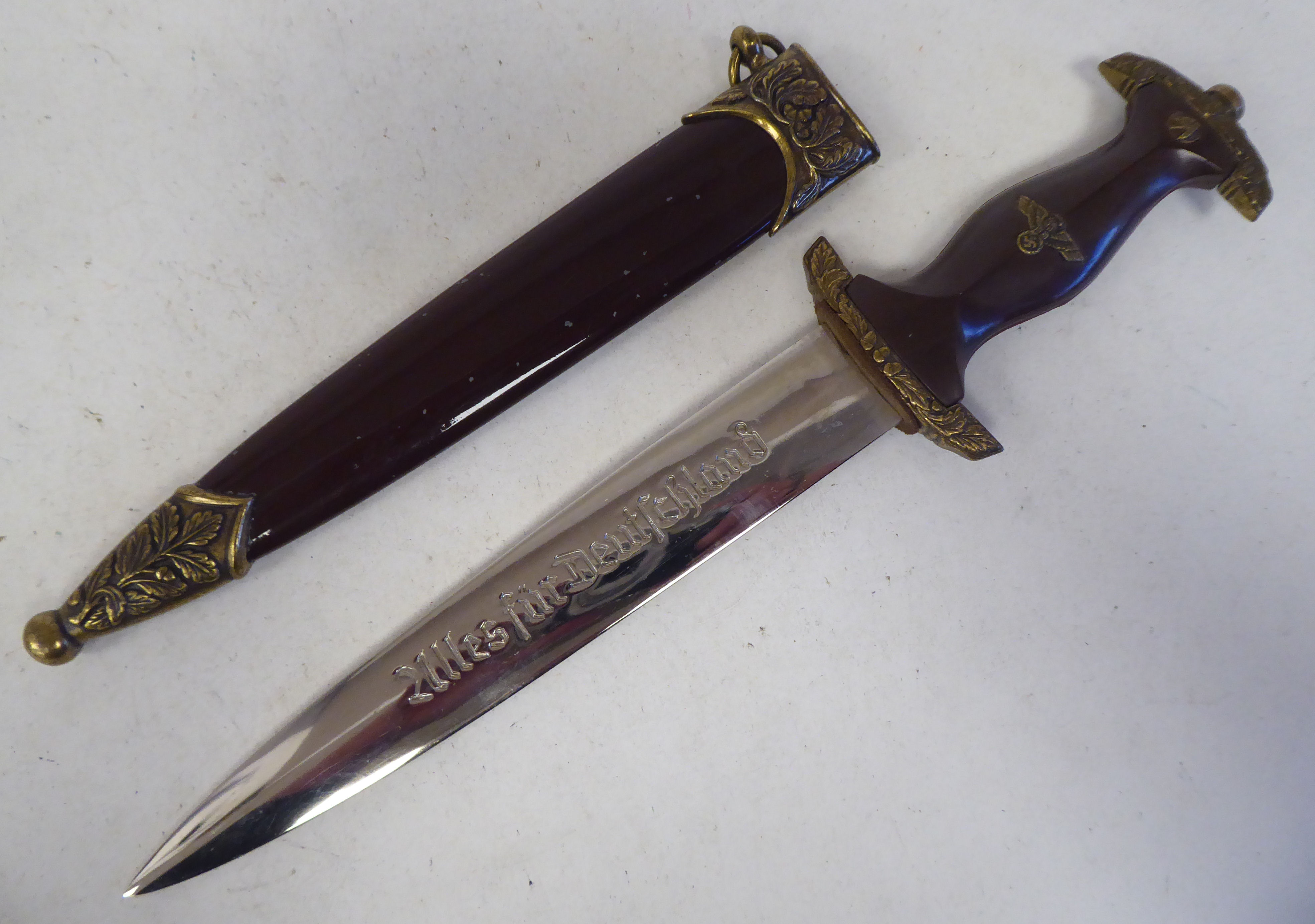 A German Army Stormtrooper presentation dagger with gilded emblems and mounts and a waisted