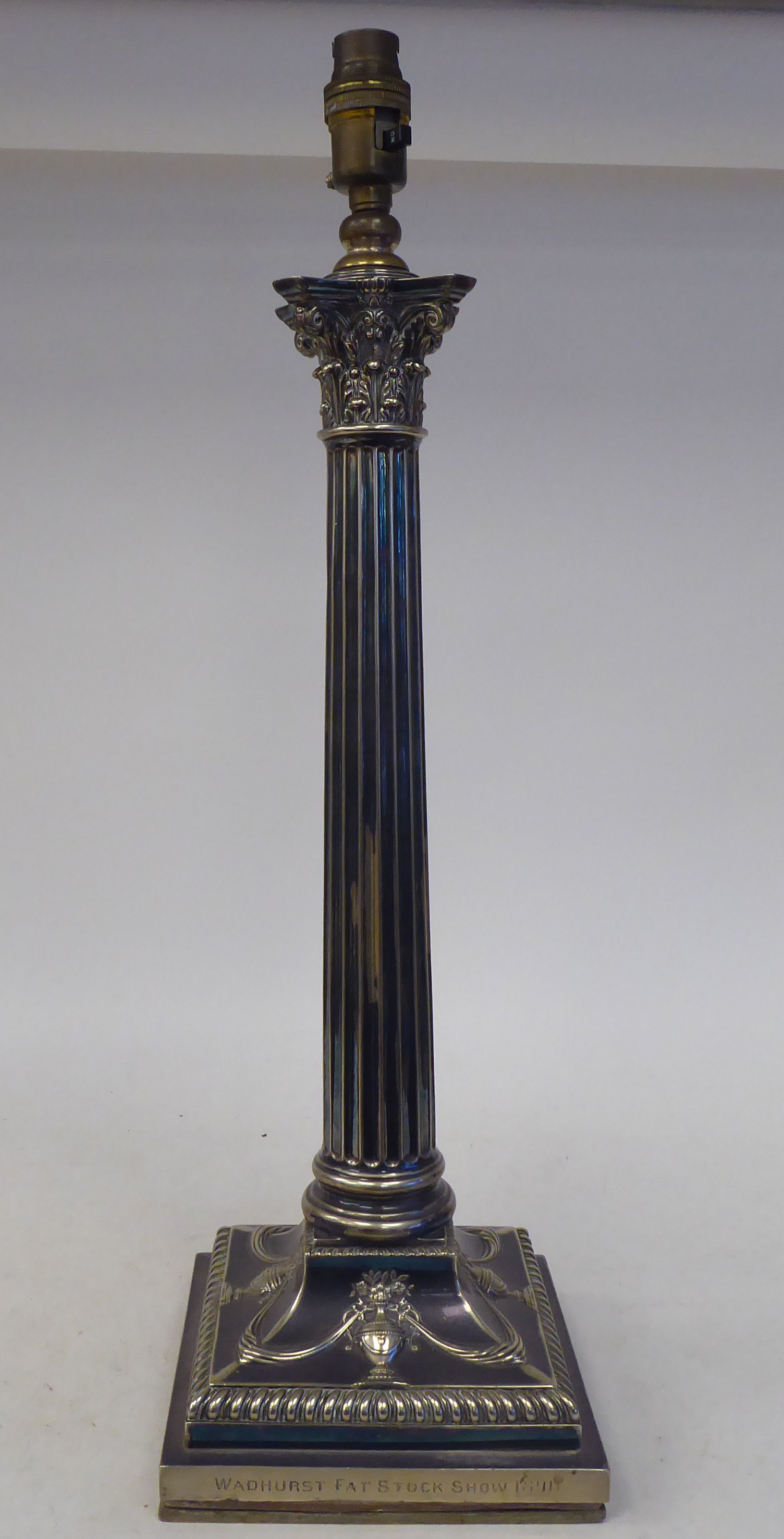 An early 20thC neo classically styled silver plated table lamp, comprising a Corinthian capital,
