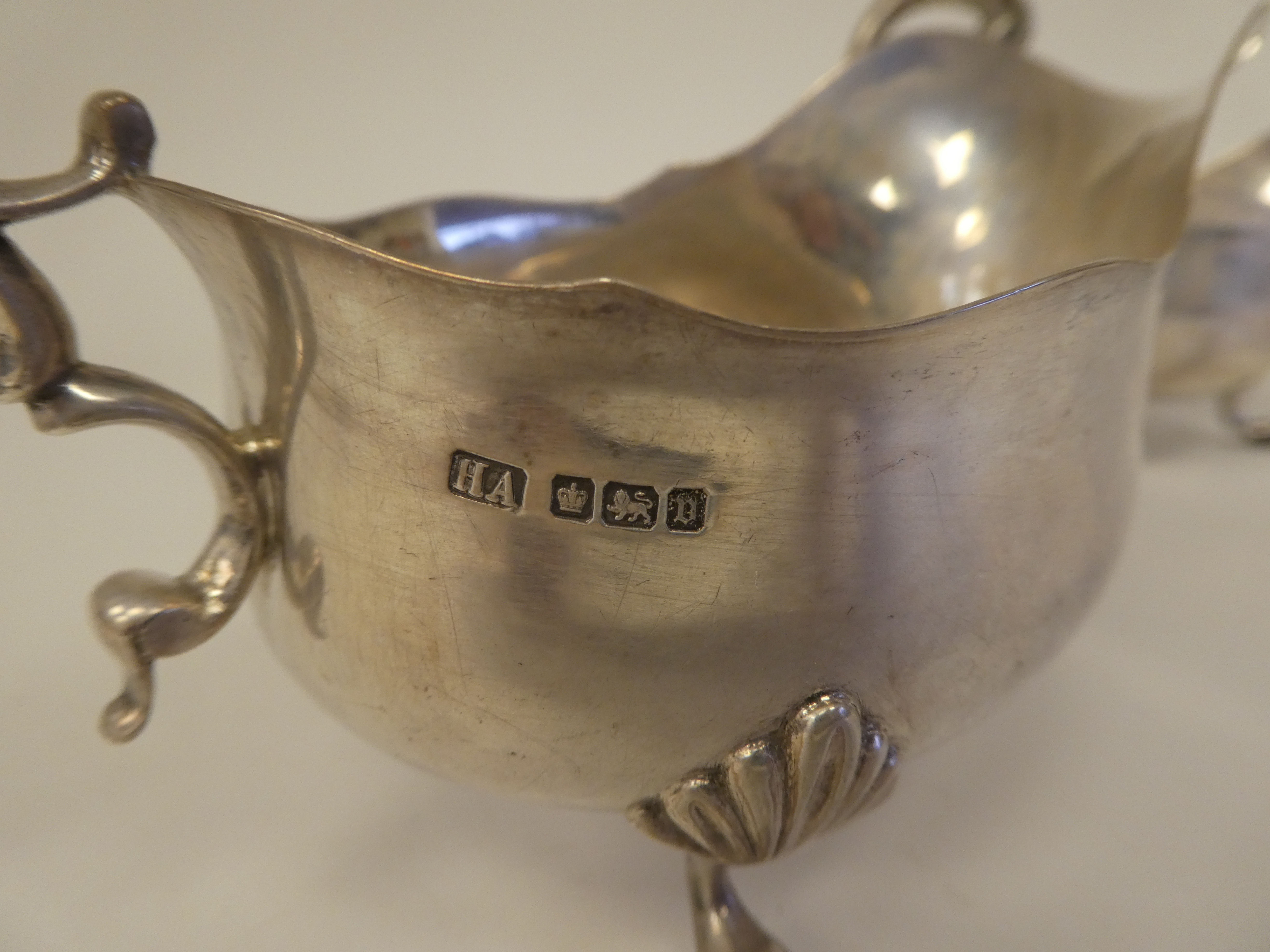 A pair of silver sauce boats with cut, wavy rims and double C-scrolled handles, elevated on shell - Image 4 of 4