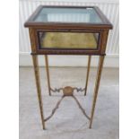 A late 19th/early 20thC satinwood, hinged top display table, decorated in delicately painted