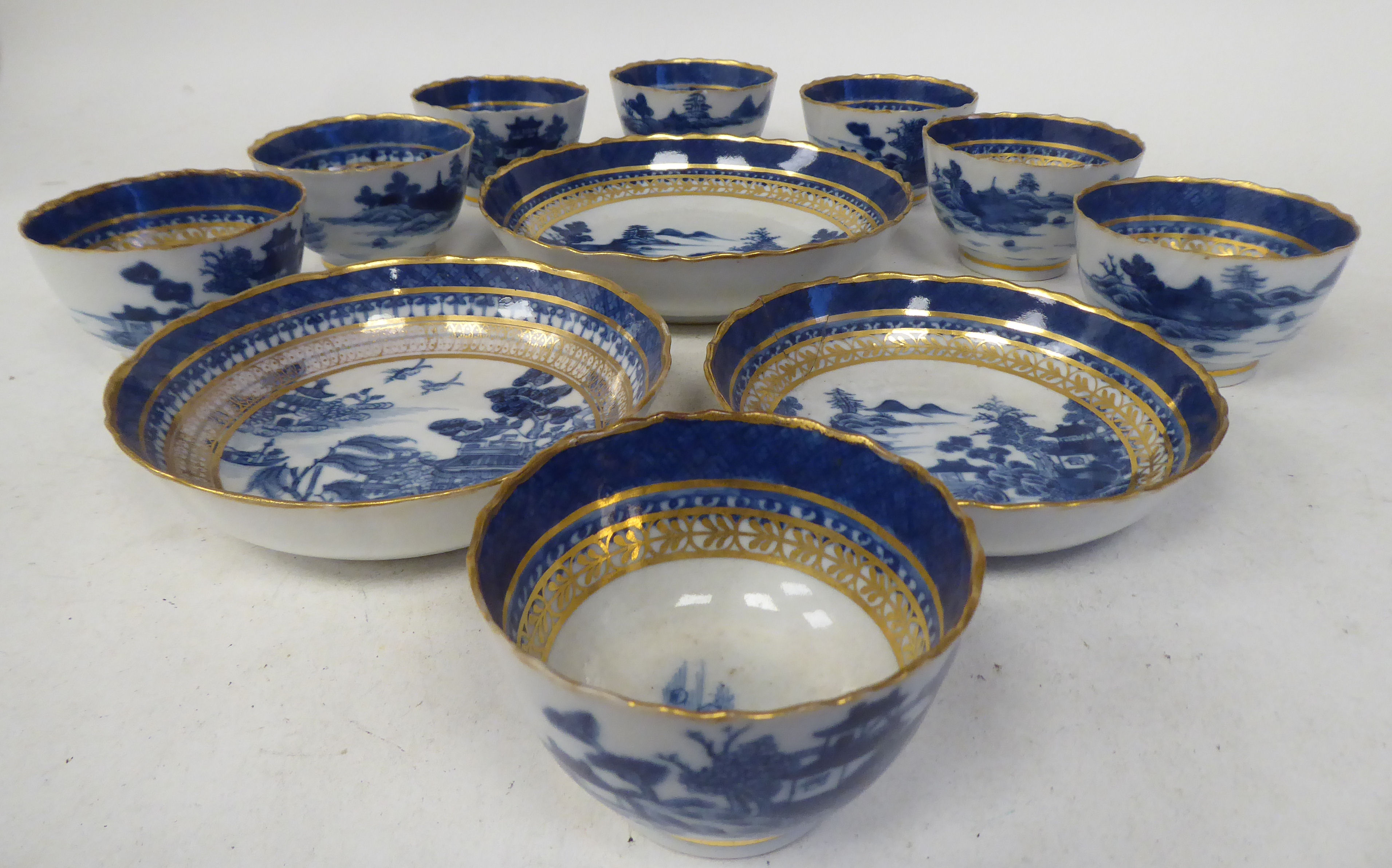 Late 18thC porcelain teaware, decorated in blue, white and gilding with Chinese seascapes, small