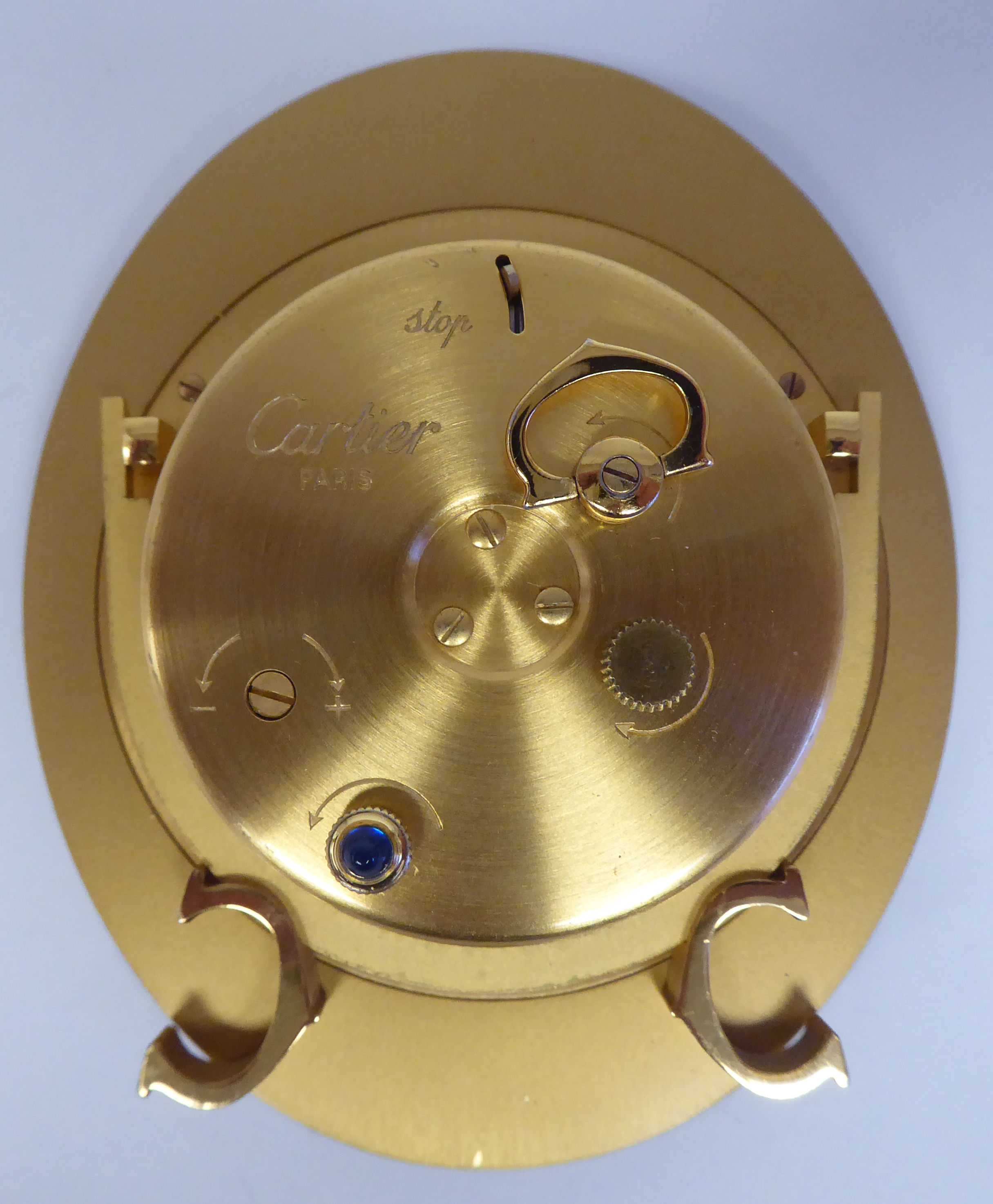 A Cartier travel clock, No.7511 00638, in a gilded and black enamel oval case, on an easel stand; - Image 5 of 6