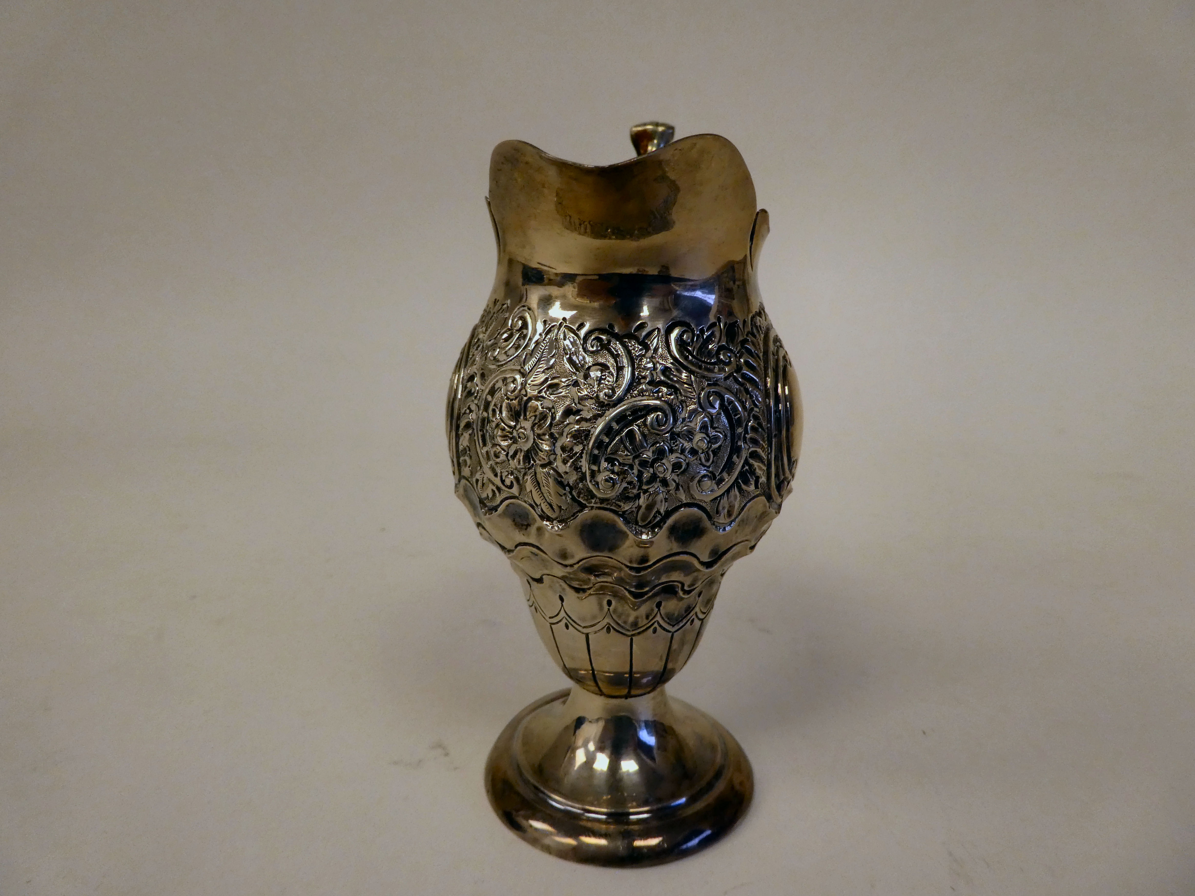 A late Victorian silver pedestal cream jug of pear form with a double C-scrolled handle, scaled, - Image 4 of 5