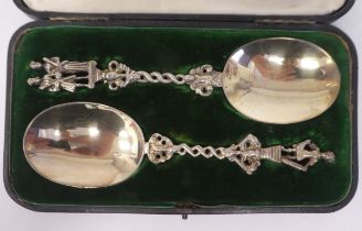 A pair of late Victorian silver gilt presentation anointing style spoons with decoratively cast
