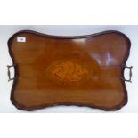 A late Victorian/Edwardian mahogany galleried serving tray of serpentine outline with a central