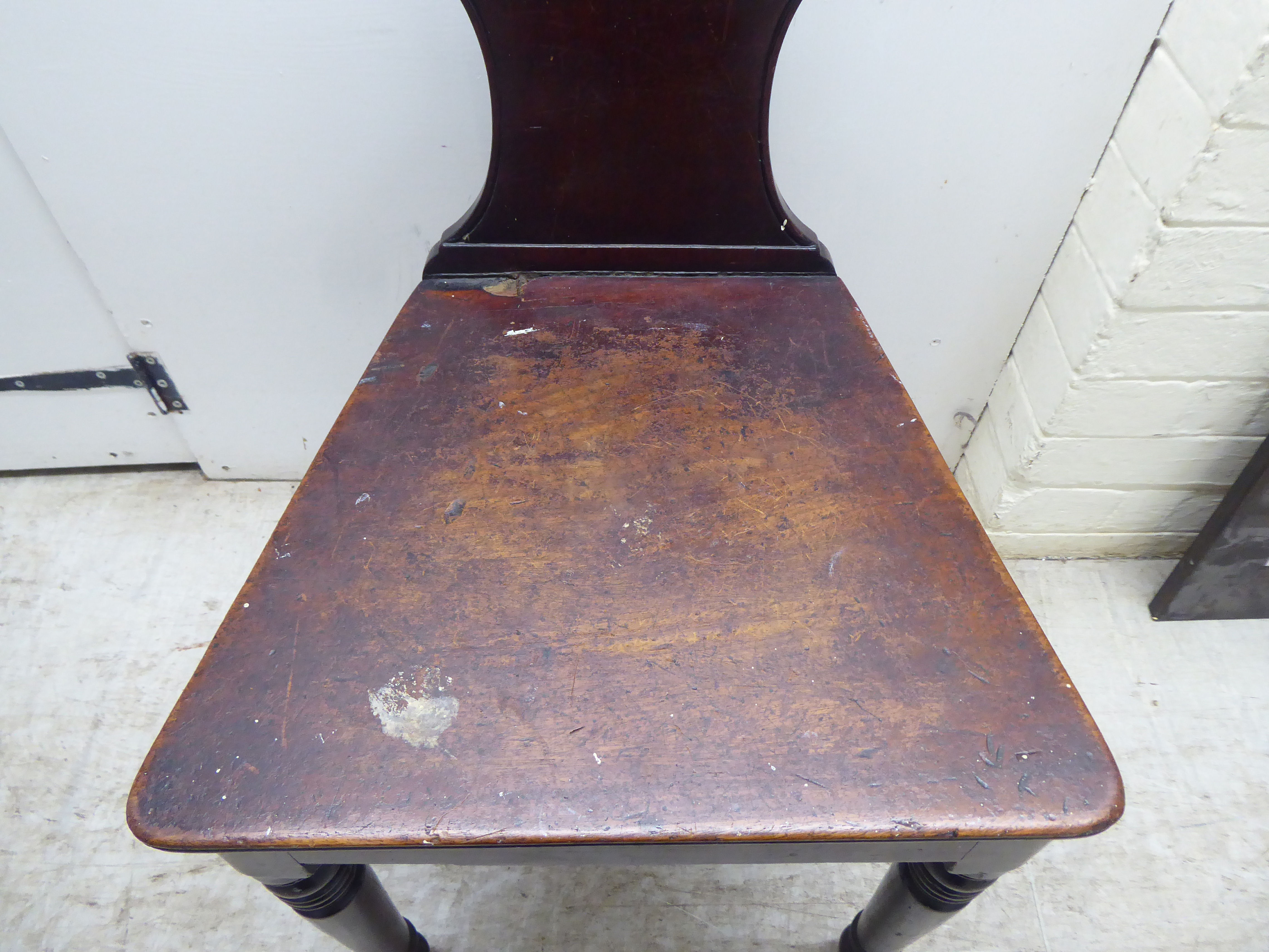 A William IV mahogany hall chair with a twin C-scroll design back, the solid seat raised on ring - Image 4 of 5