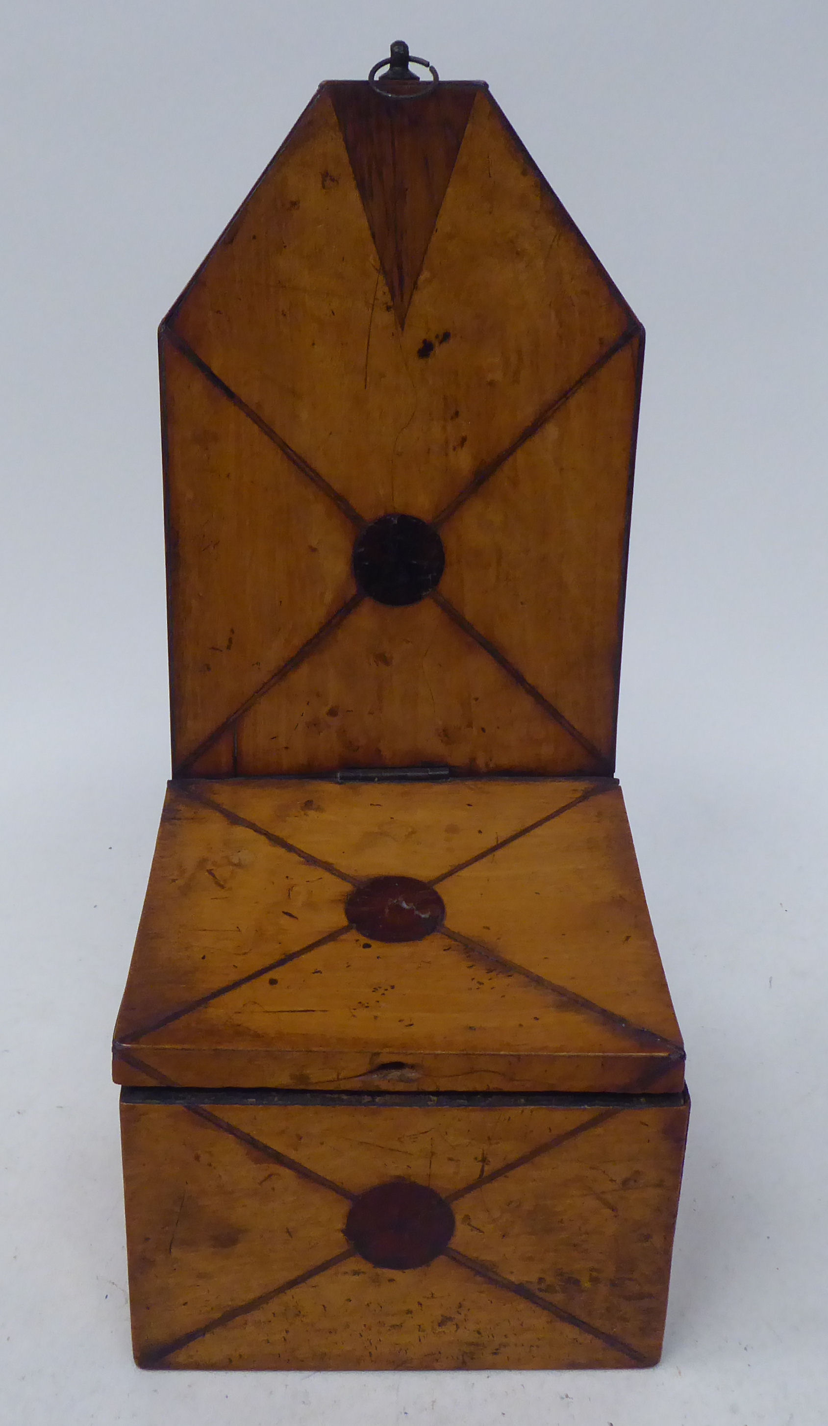An early 19thC treen satinwood wall hanging salt box with an extended backplate, over an angled