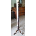 A 1920/30s mahogany standard lamp with a carved, reeded column, raised on a tripod base  60"h