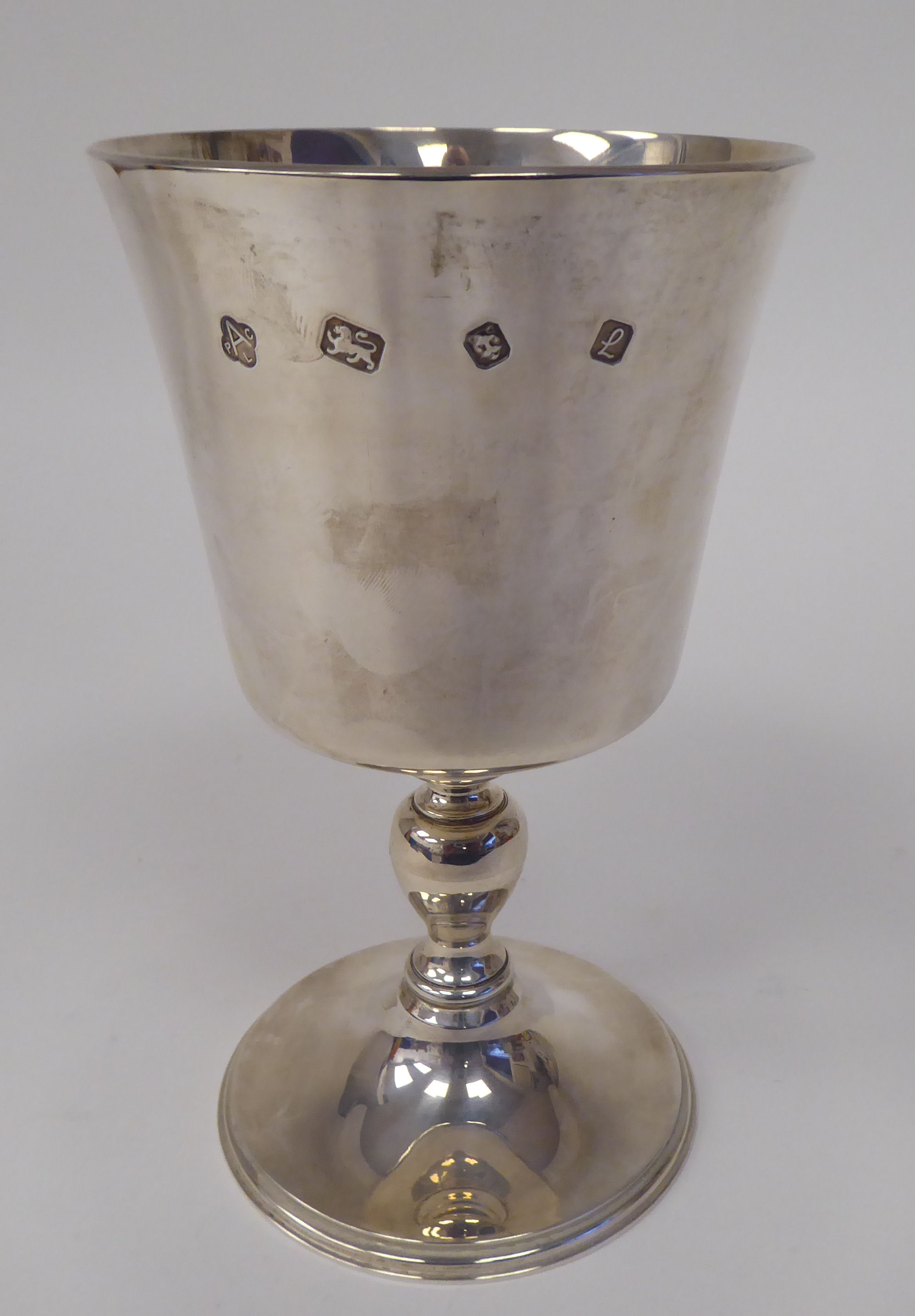 A silver goblet, the bucket shaped bowl over a baluster pedestal and domed foot  Asprey & Co  London