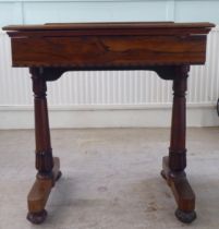 A William IV rosewood reading table with a hinged top, over a height adjustable lectern, on a