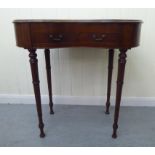 An Edwardian satinwood inlaid mahogany, kidney shaped display table with a hinged lid, over two