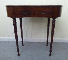 An Edwardian satinwood inlaid mahogany, kidney shaped display table with a hinged lid, over two