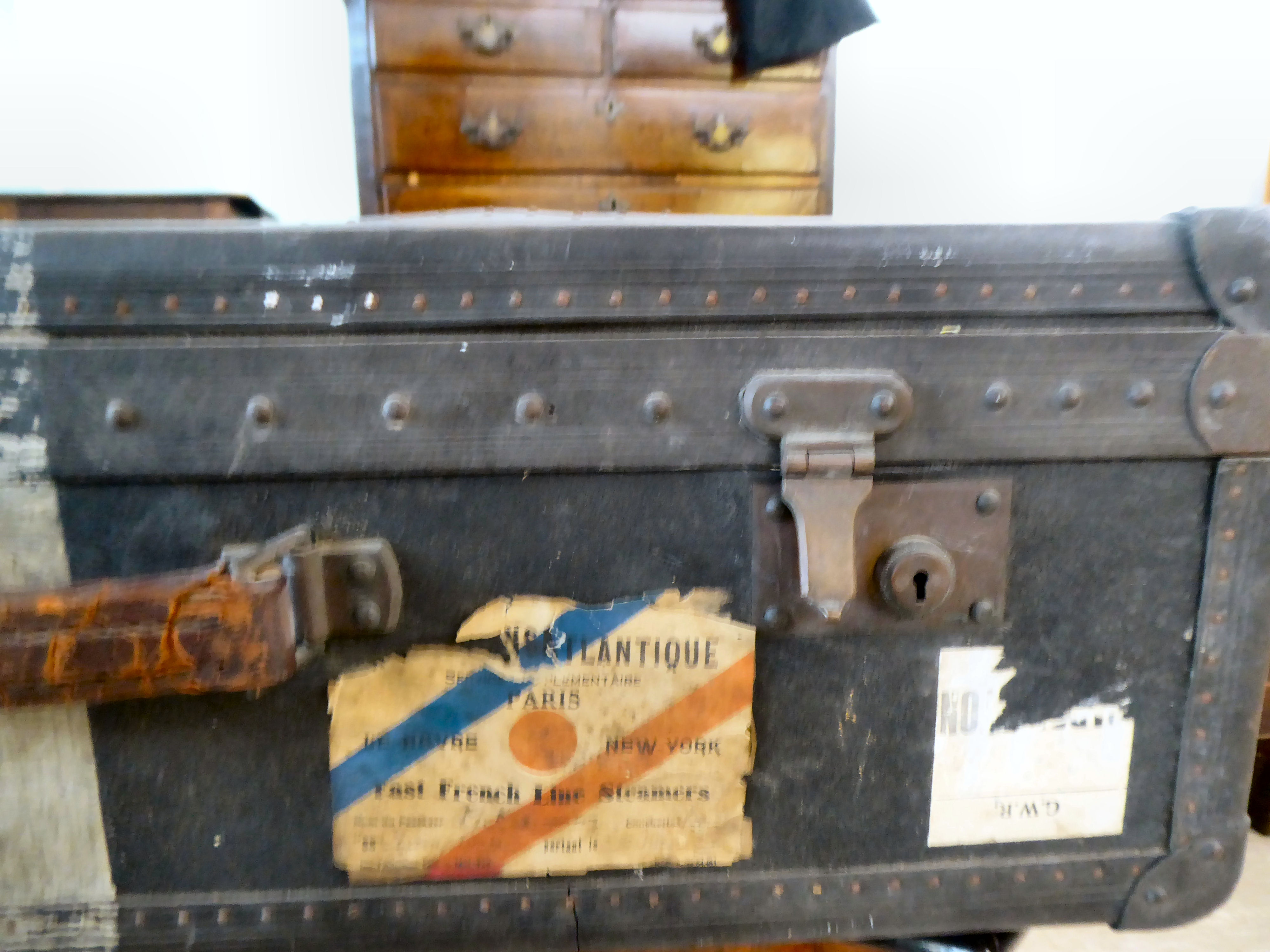 An early 20thC moulded/press composition travelling trunk with a hinged lid, bearing various - Image 3 of 9