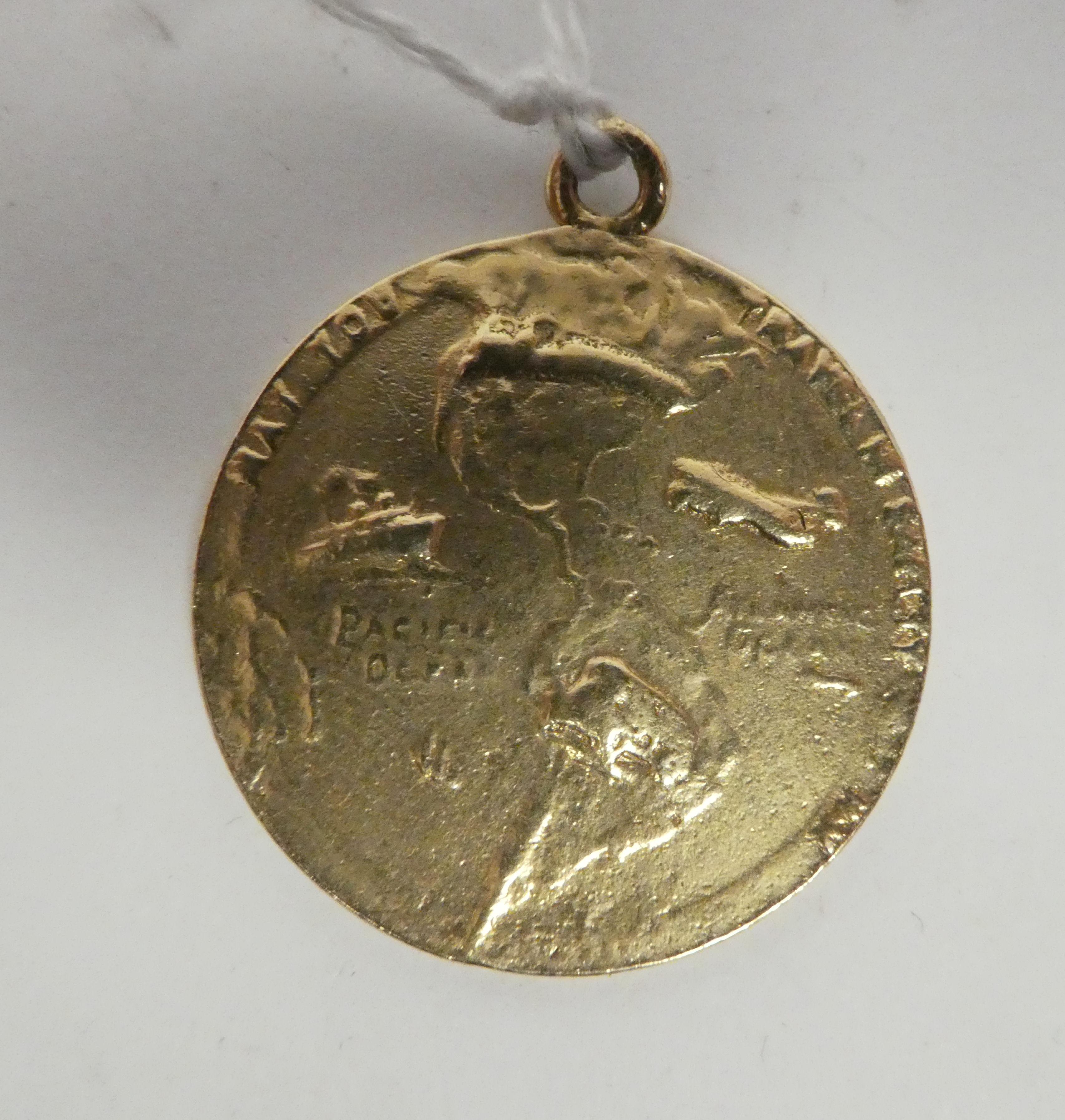 A 14ct gold St Christopher medallion, on a pendant ring with a map of North and South America on the