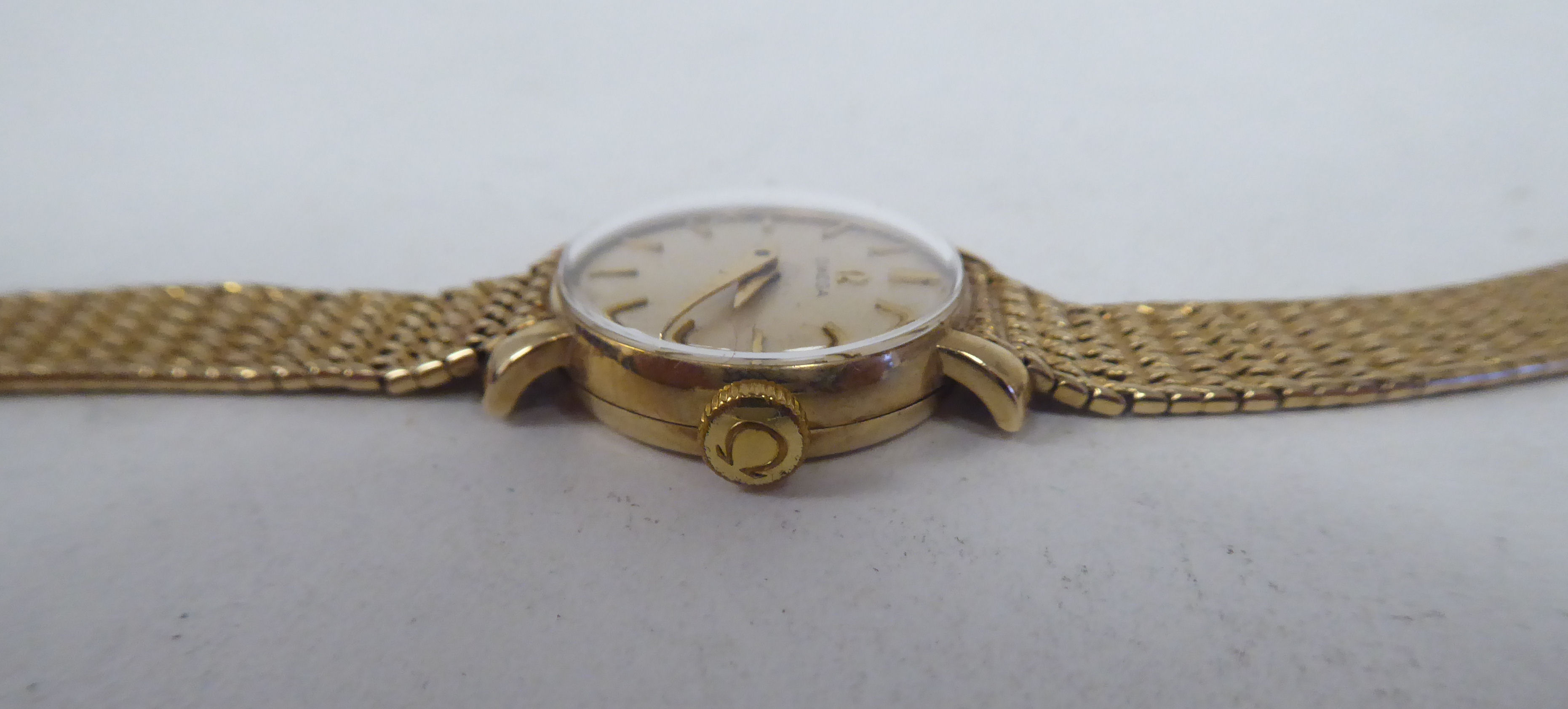 A lady's Omega 9ct round cased bracelet wristwatch, the manual wind mechanism faced by a baton dial - Image 3 of 7